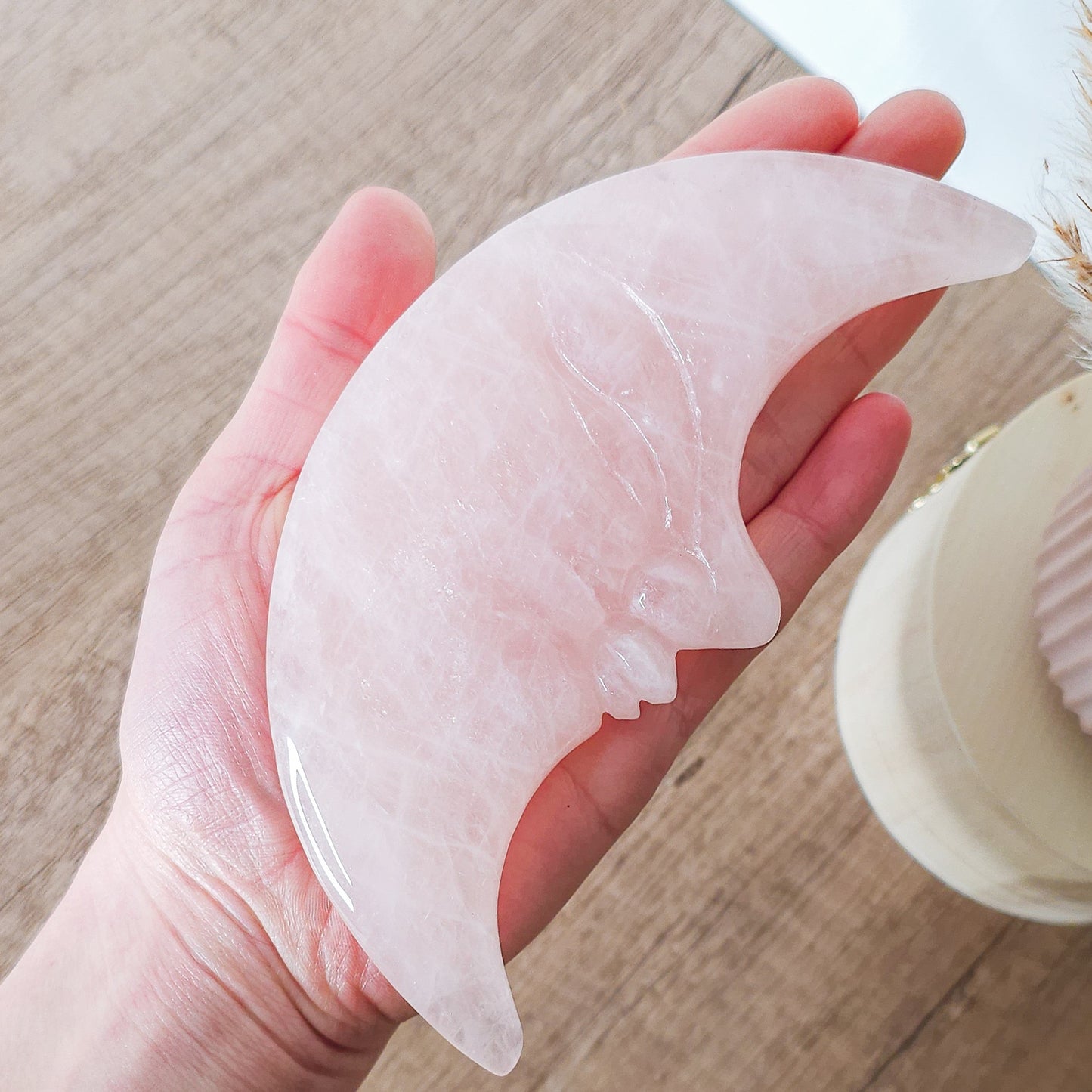 Rose Quartz Moon Face on the stand