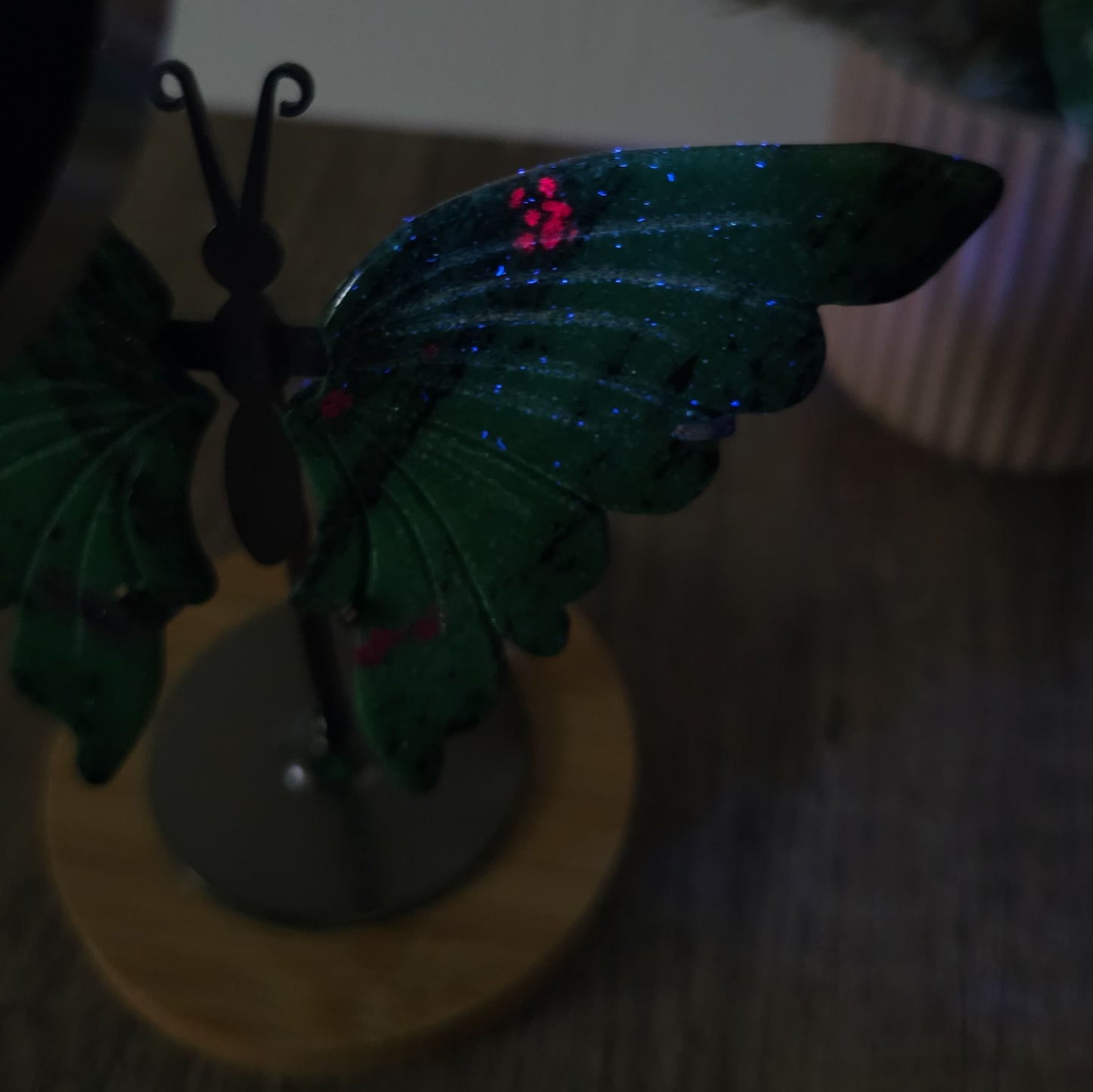 Fluorescent Ruby in Zoisite Butterfly Wings on the stand