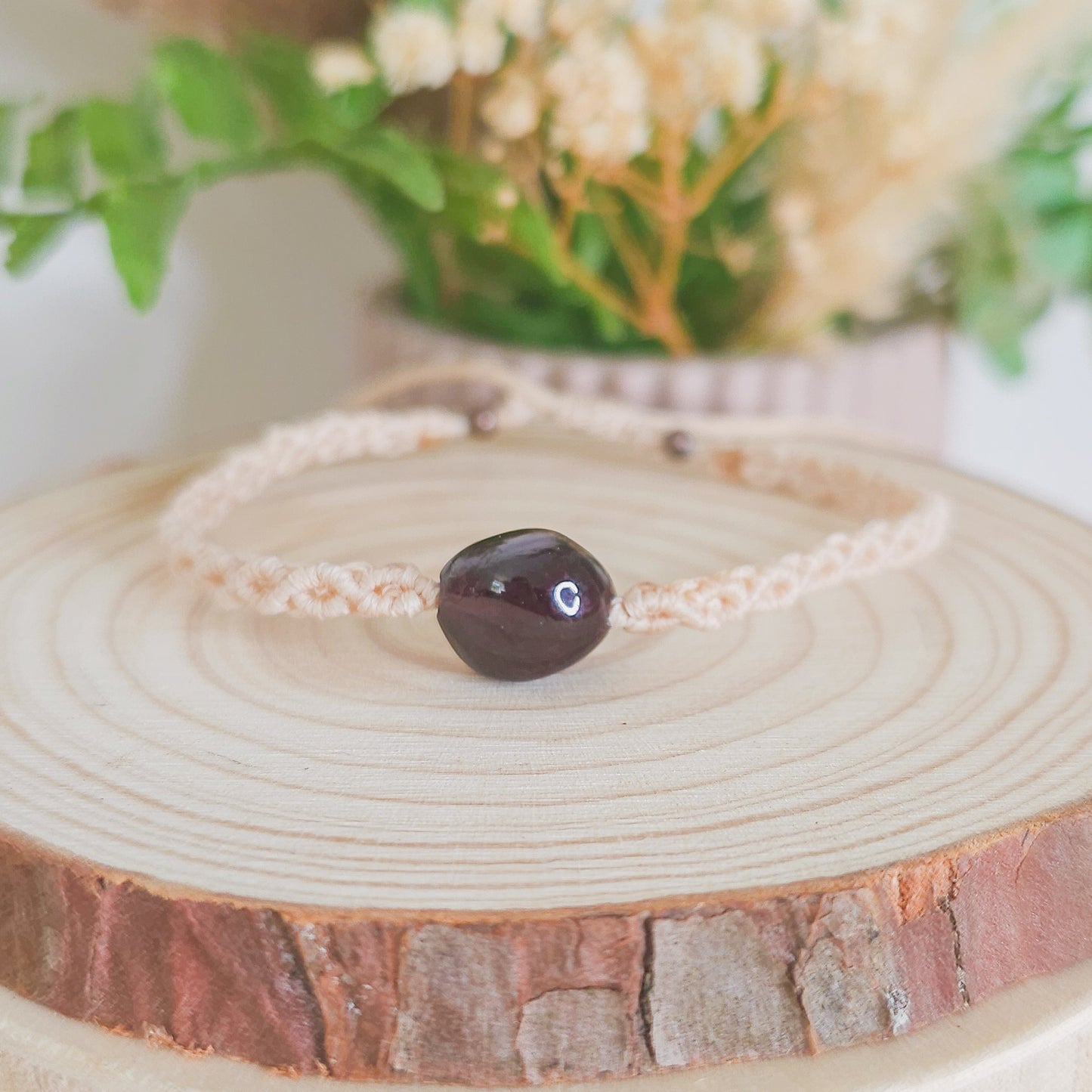 Handmade macrame bracelet with Garnet beads, infused with intention to support strength, grounding, and soul alignment