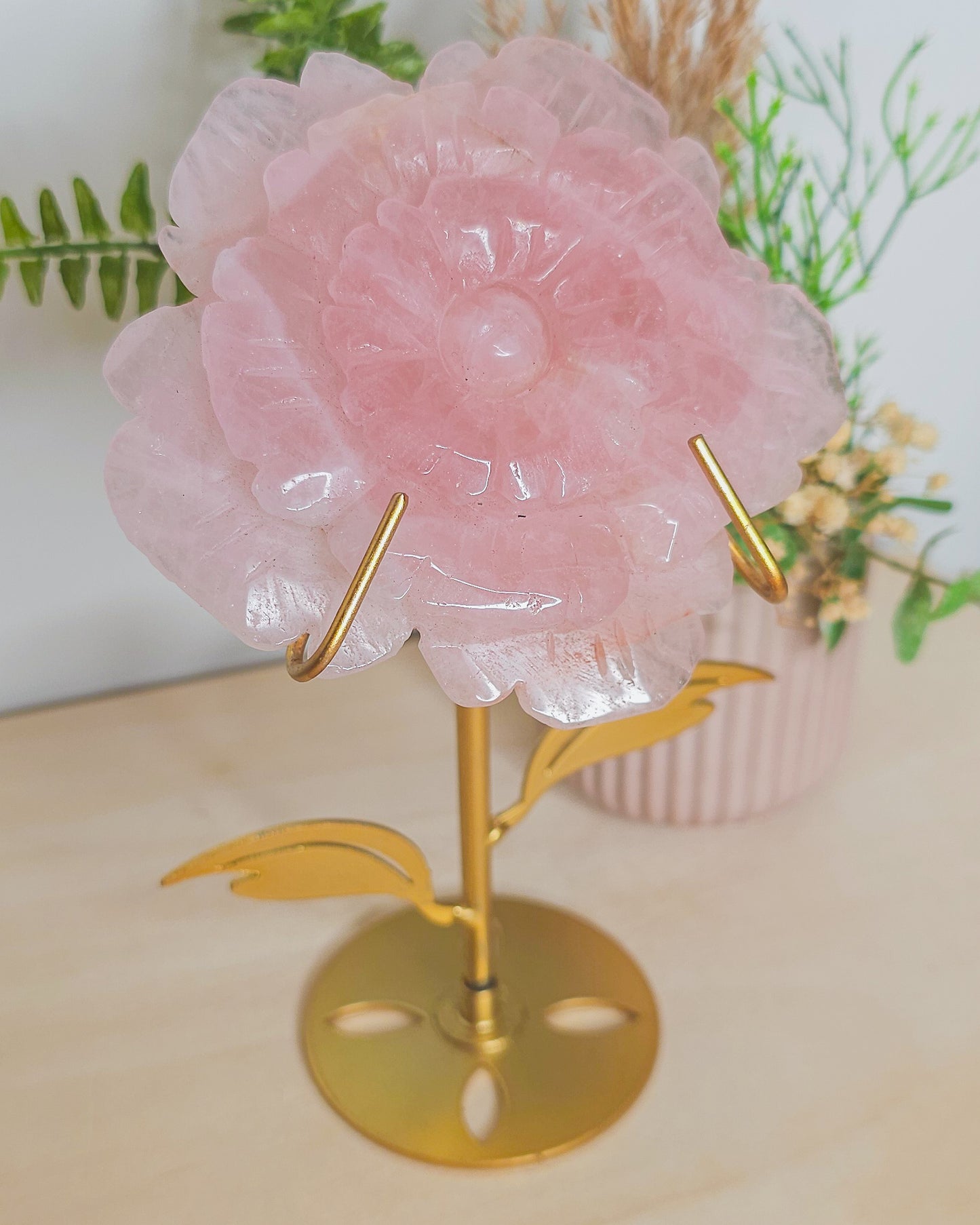 Close-up of Rose Quartz flower carving showing detailed petals and natural soft pink color, representing love, self-worth, and compassion.