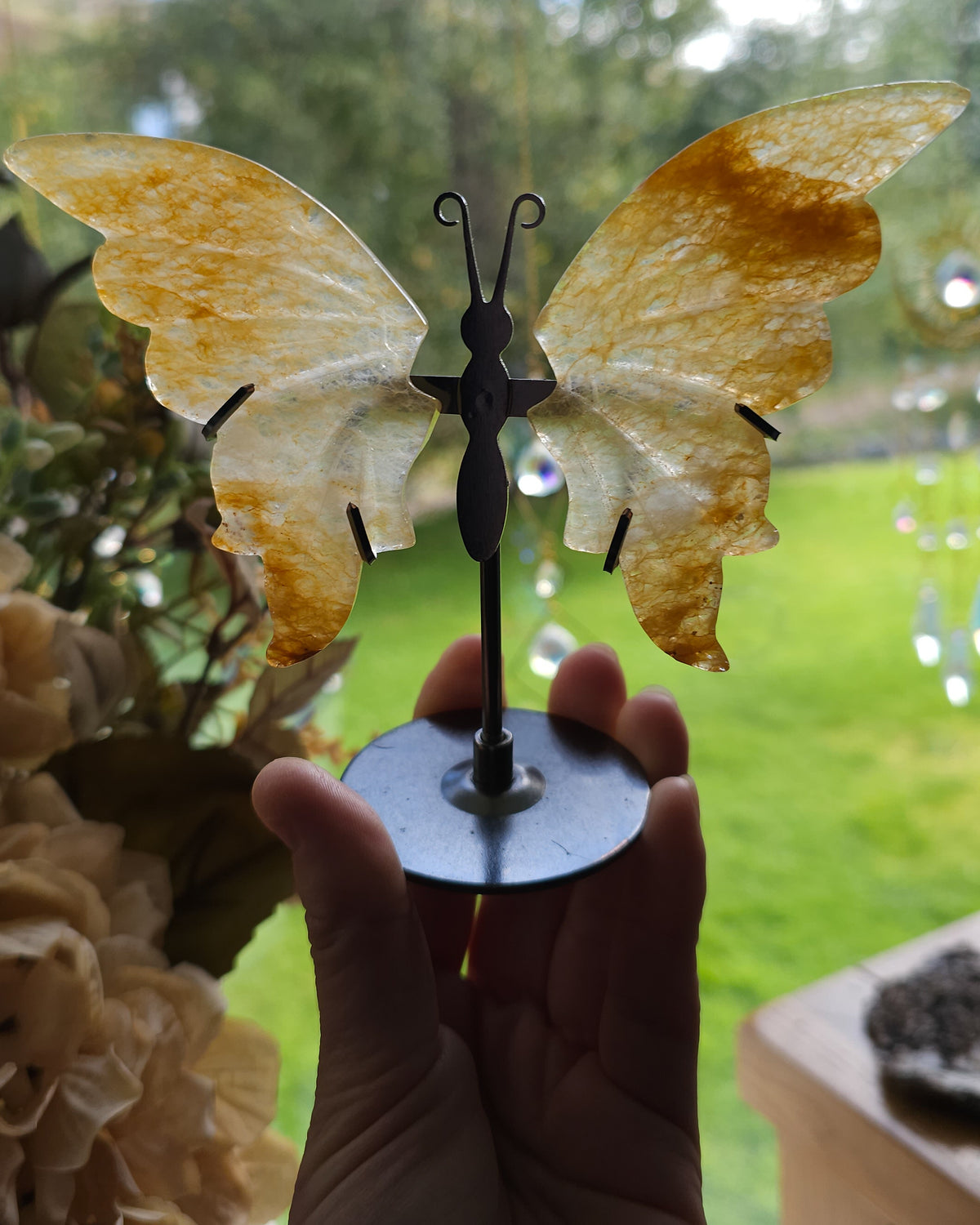 Golden Healer Quartz Butterfly Wings On The Stand