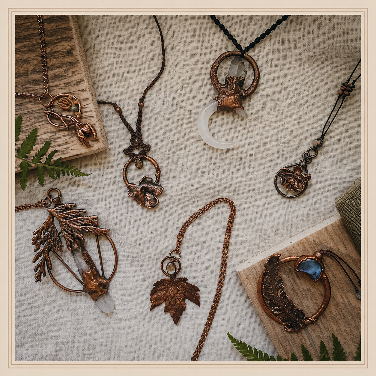 handmade copper jewellery on rustic wood and linen. electroformed crystal leaf and flower pendants.inspired by nature and artisan jewellery. made in scotland