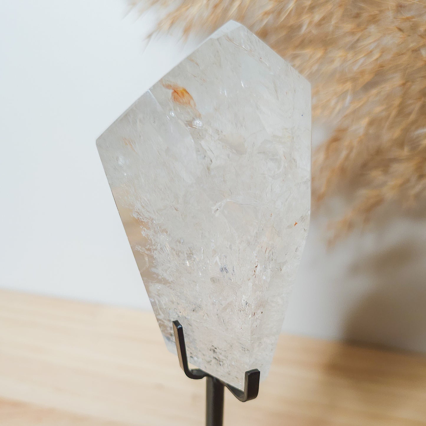 Rainbow filled Clear Quartz Free-form on the stand