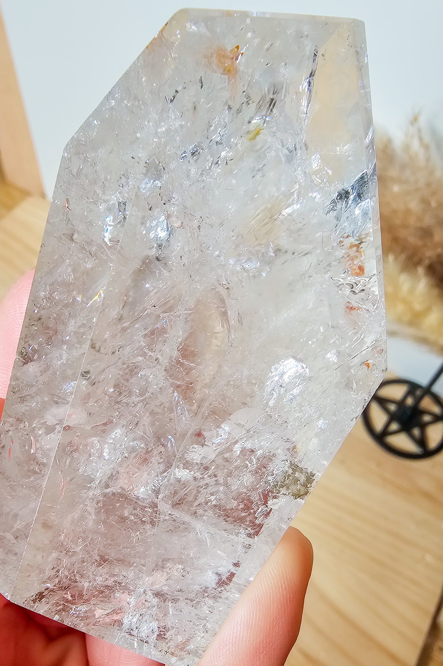 Rainbow filled Clear Quartz Free-form on the stand