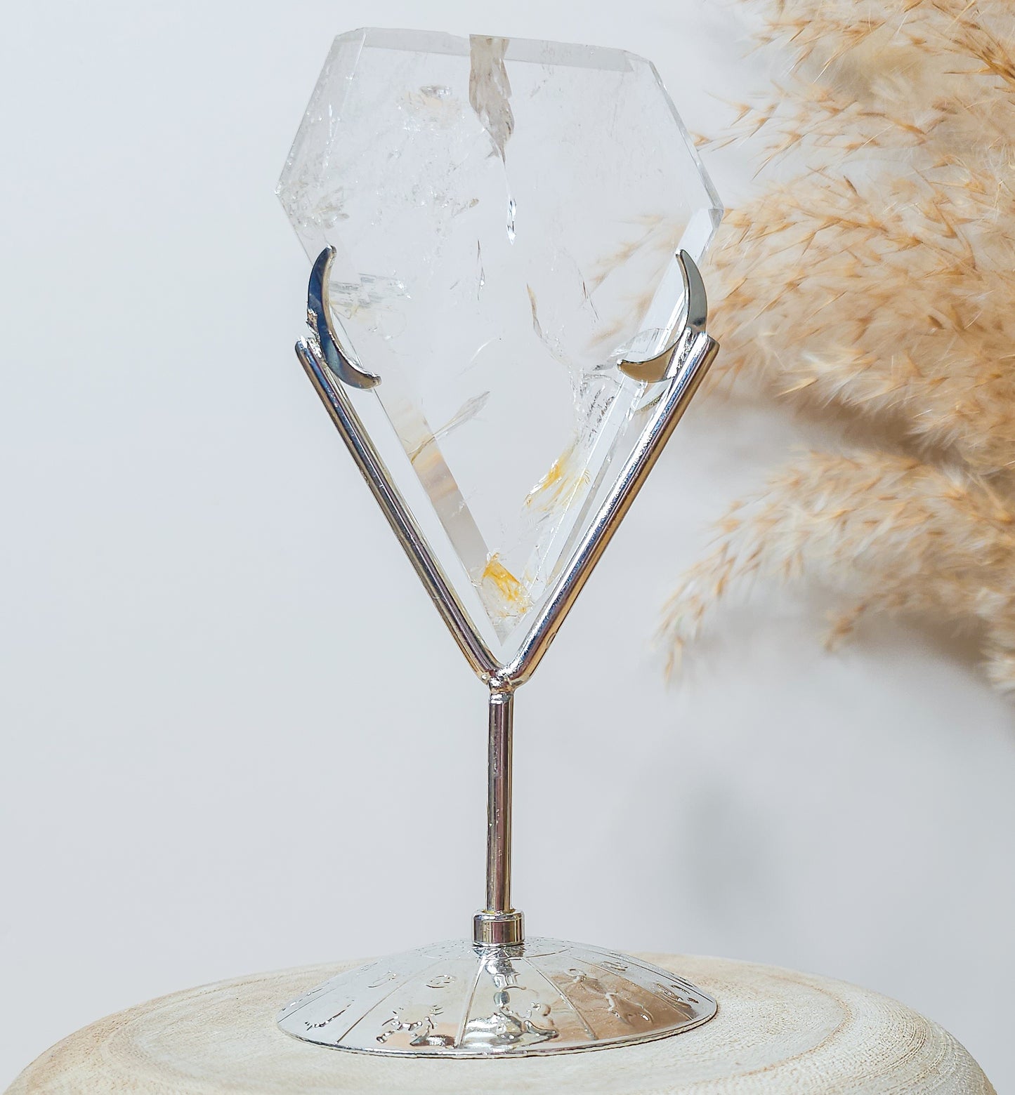 Clear Quartz with Iron Inclusions diamond on the stand