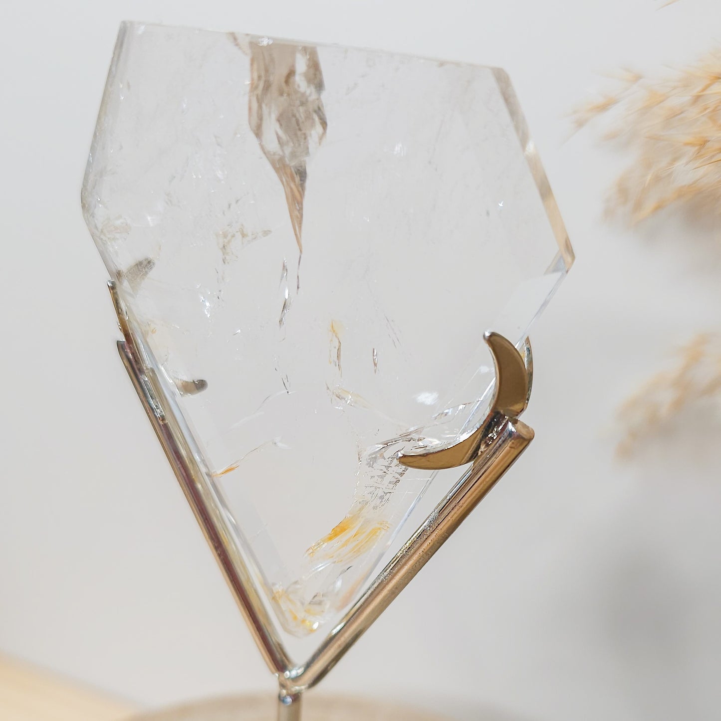 Clear Quartz with Iron Inclusions diamond on the stand