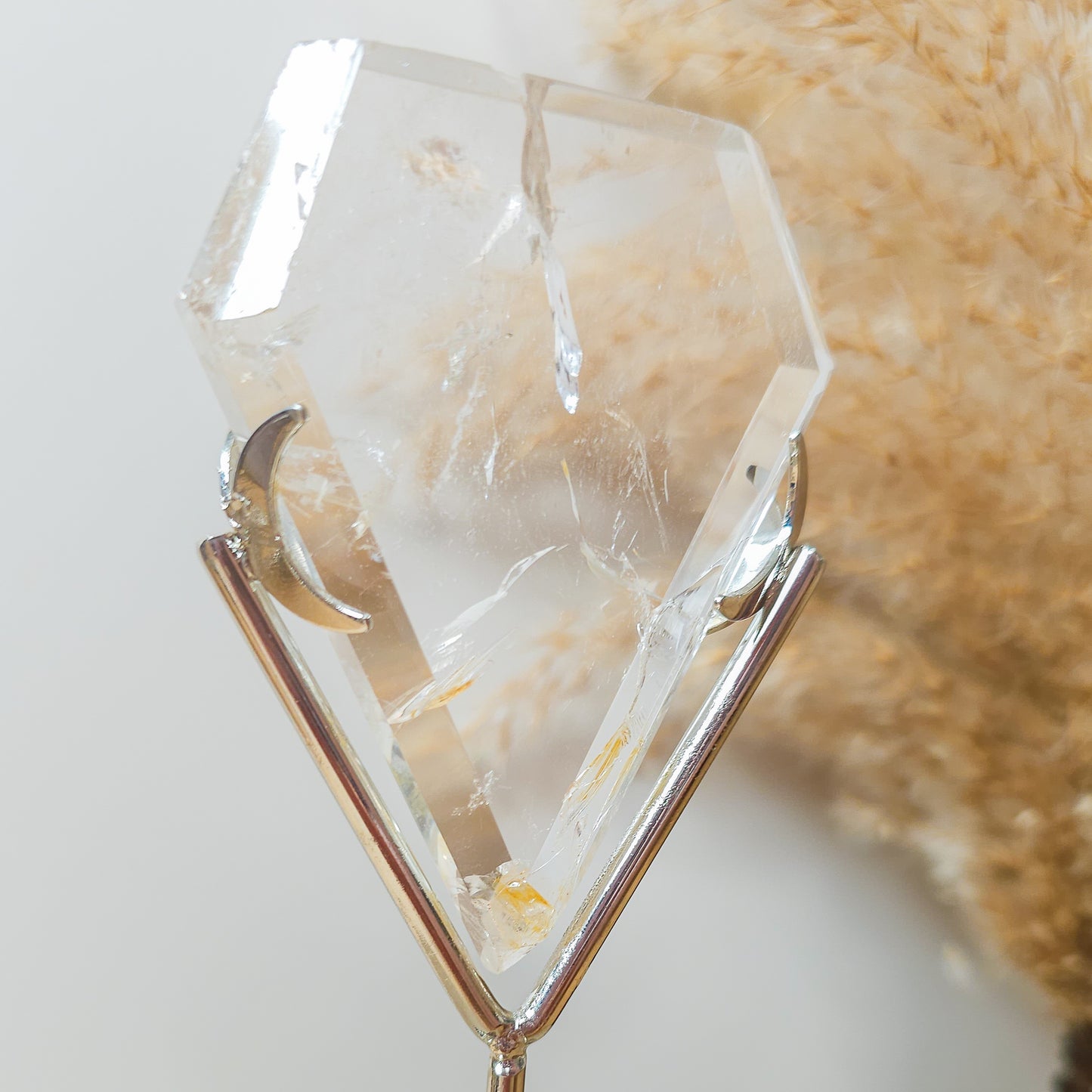 Clear Quartz with Iron Inclusions diamond on the stand