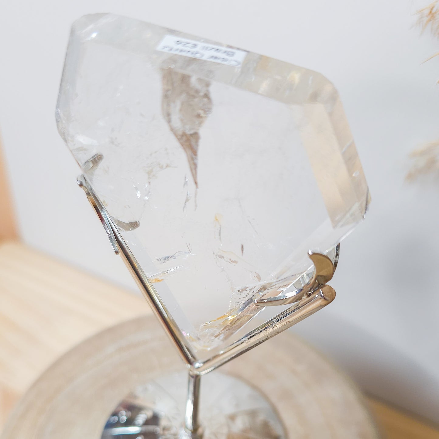 Clear Quartz with Iron Inclusions diamond on the stand