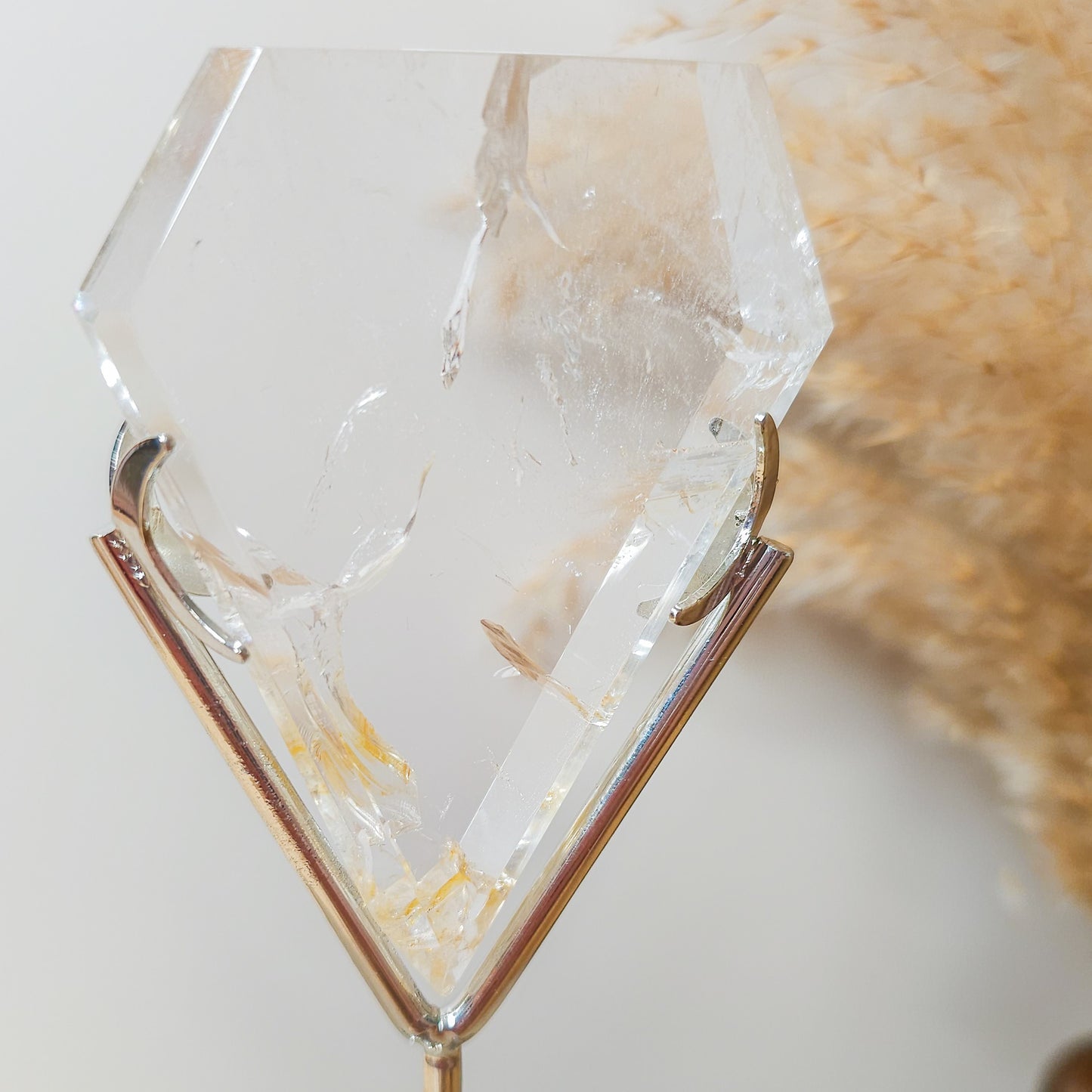 Clear Quartz with Iron Inclusions diamond on the stand