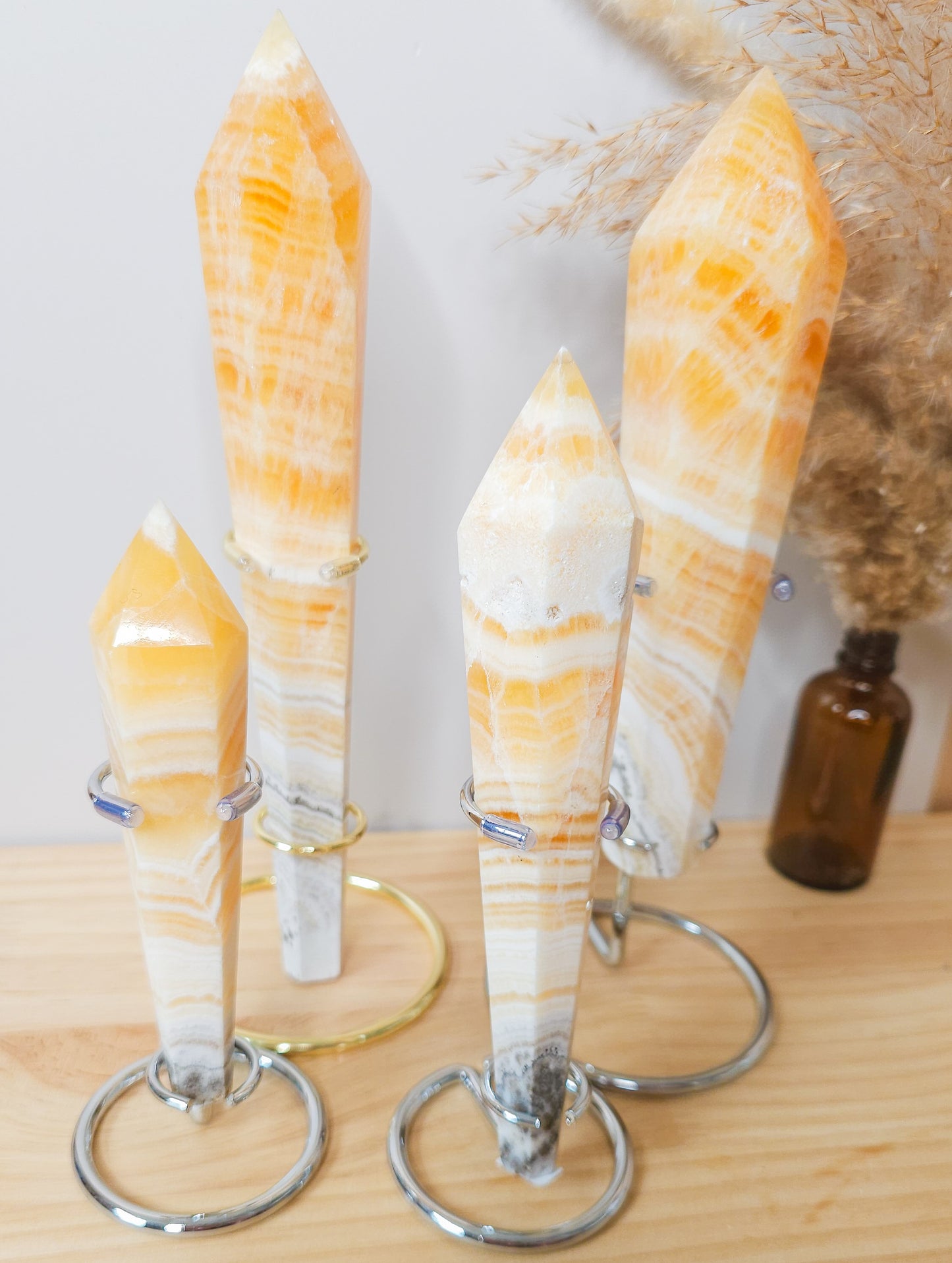 High Quality Orange Calcite Wands on the stand