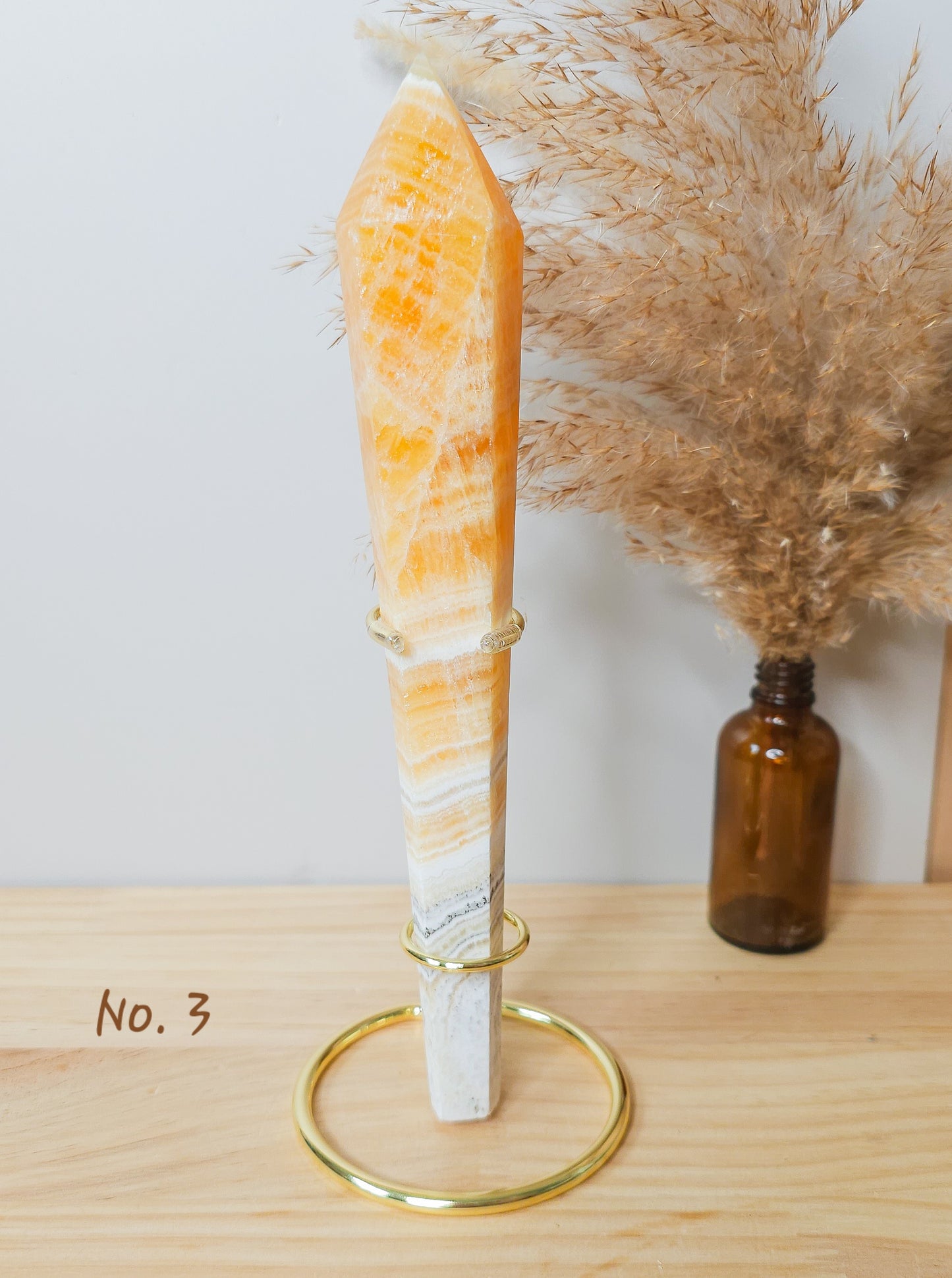 High Quality Orange Calcite Wands on the stand