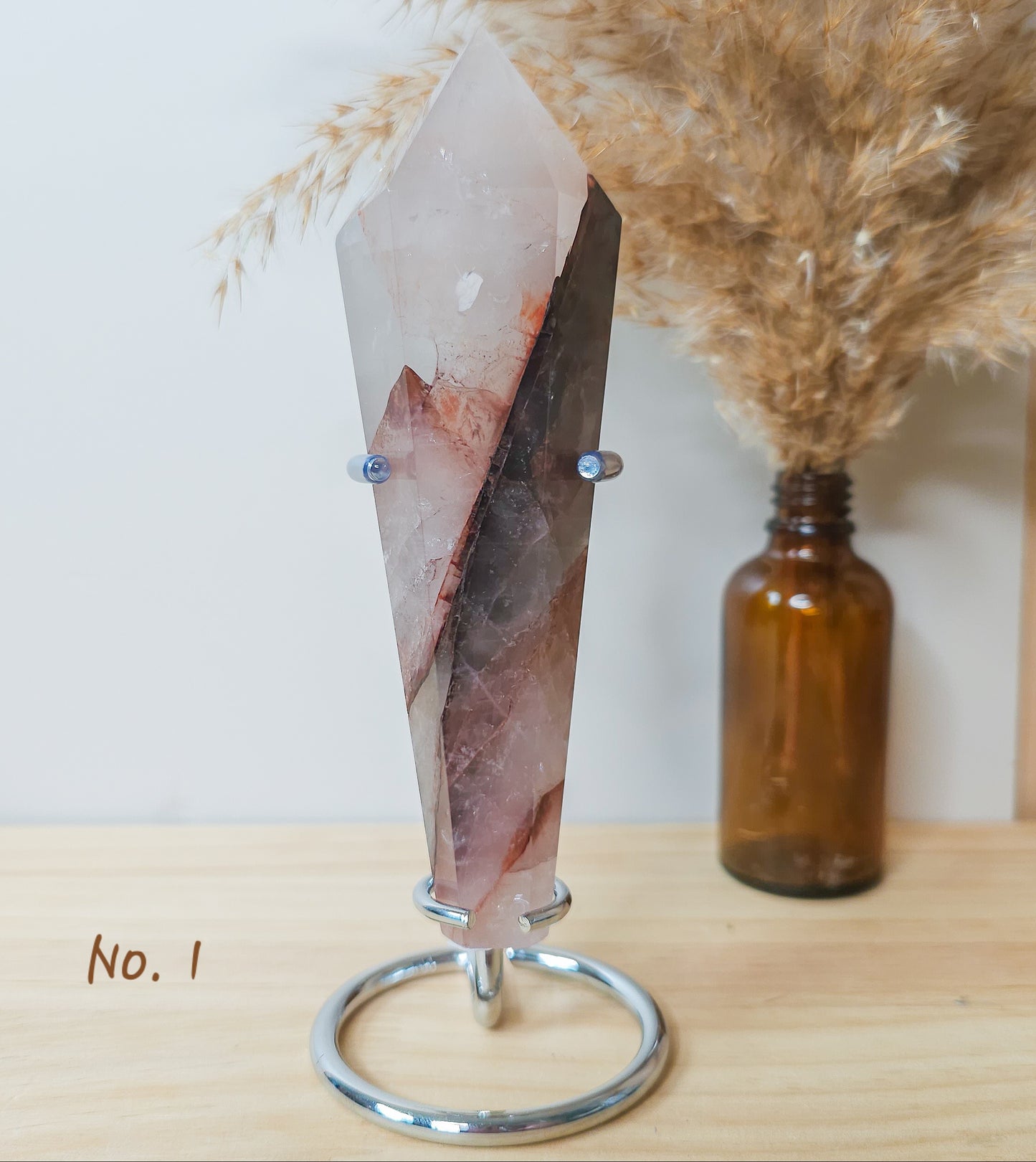 Red Hematoid/Fire Quartz Wand on the stand