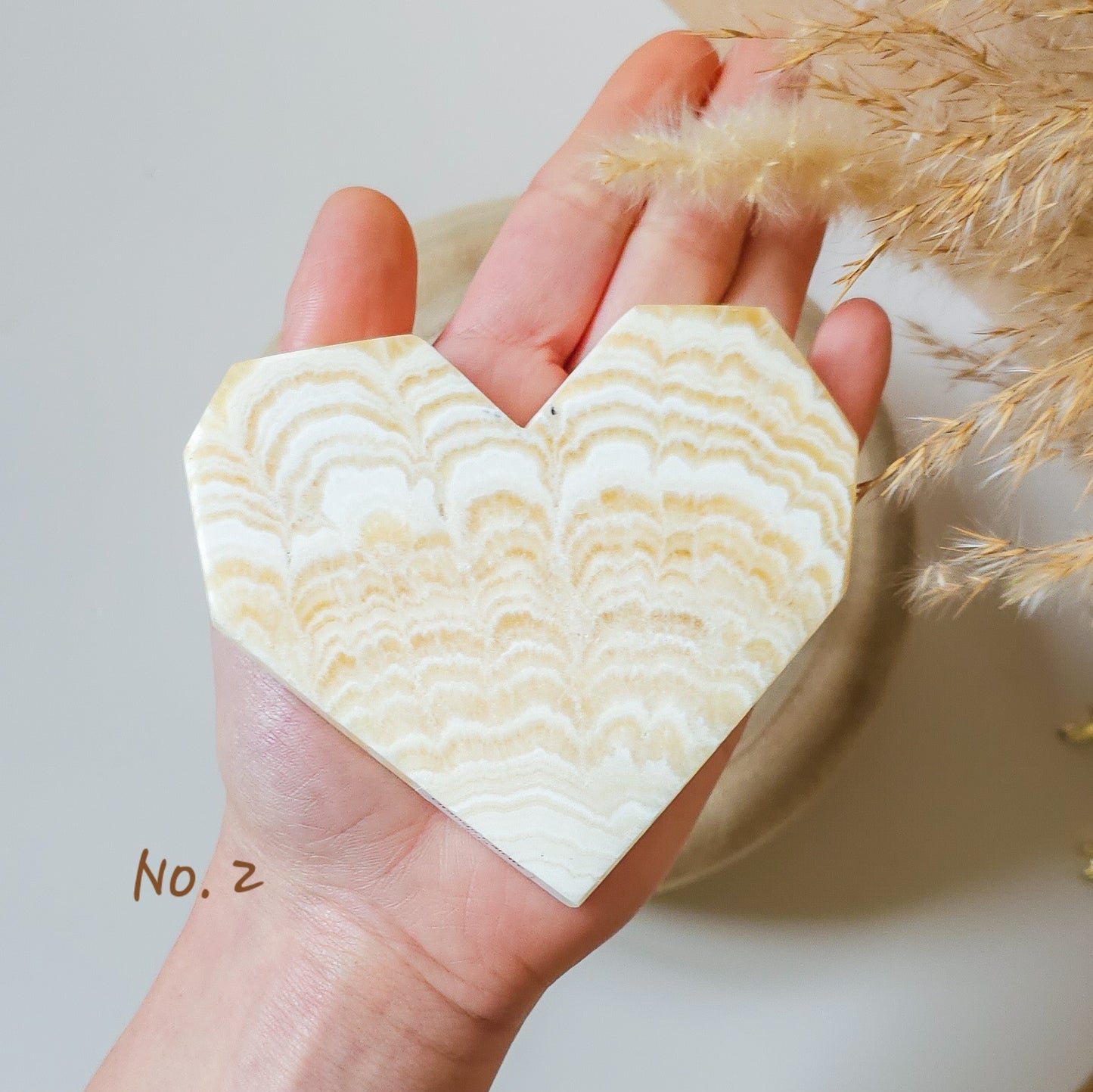 Banded Orange Calcite Hearts on stand