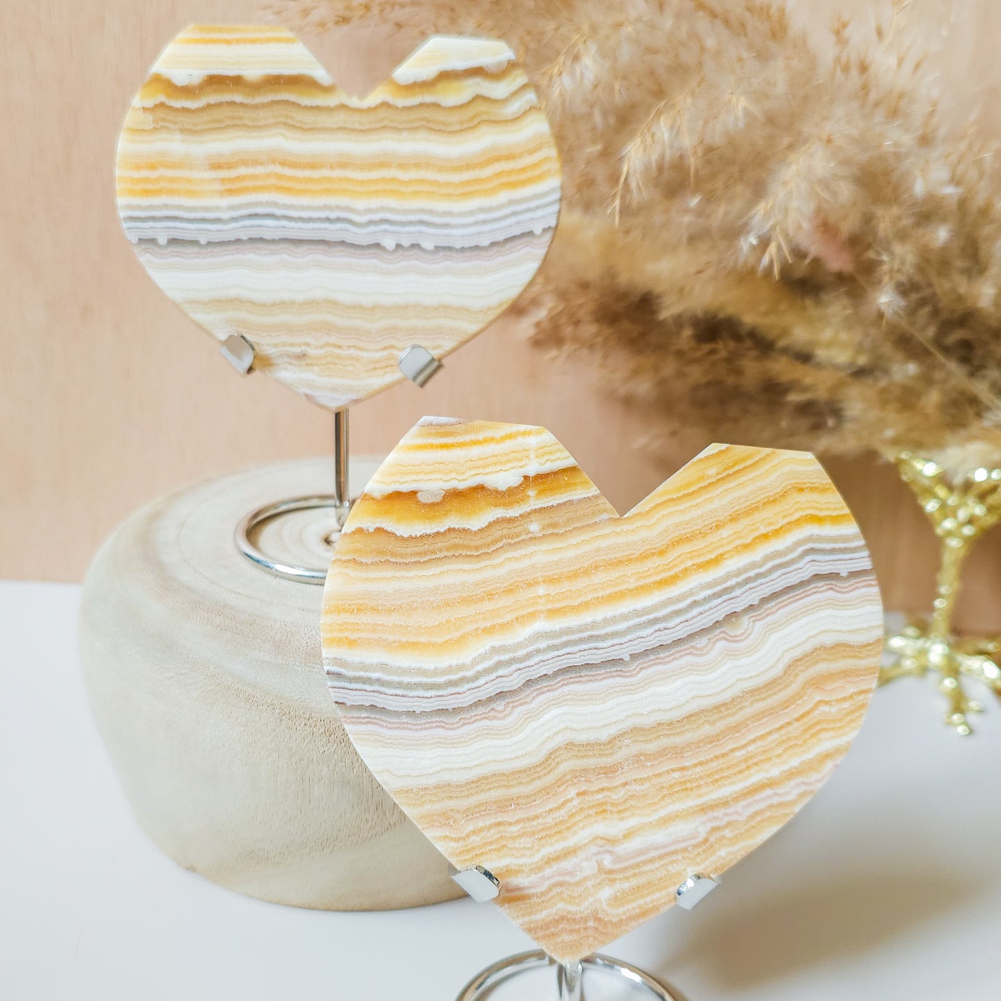 Vivid Orange Calcite Hearts on stand