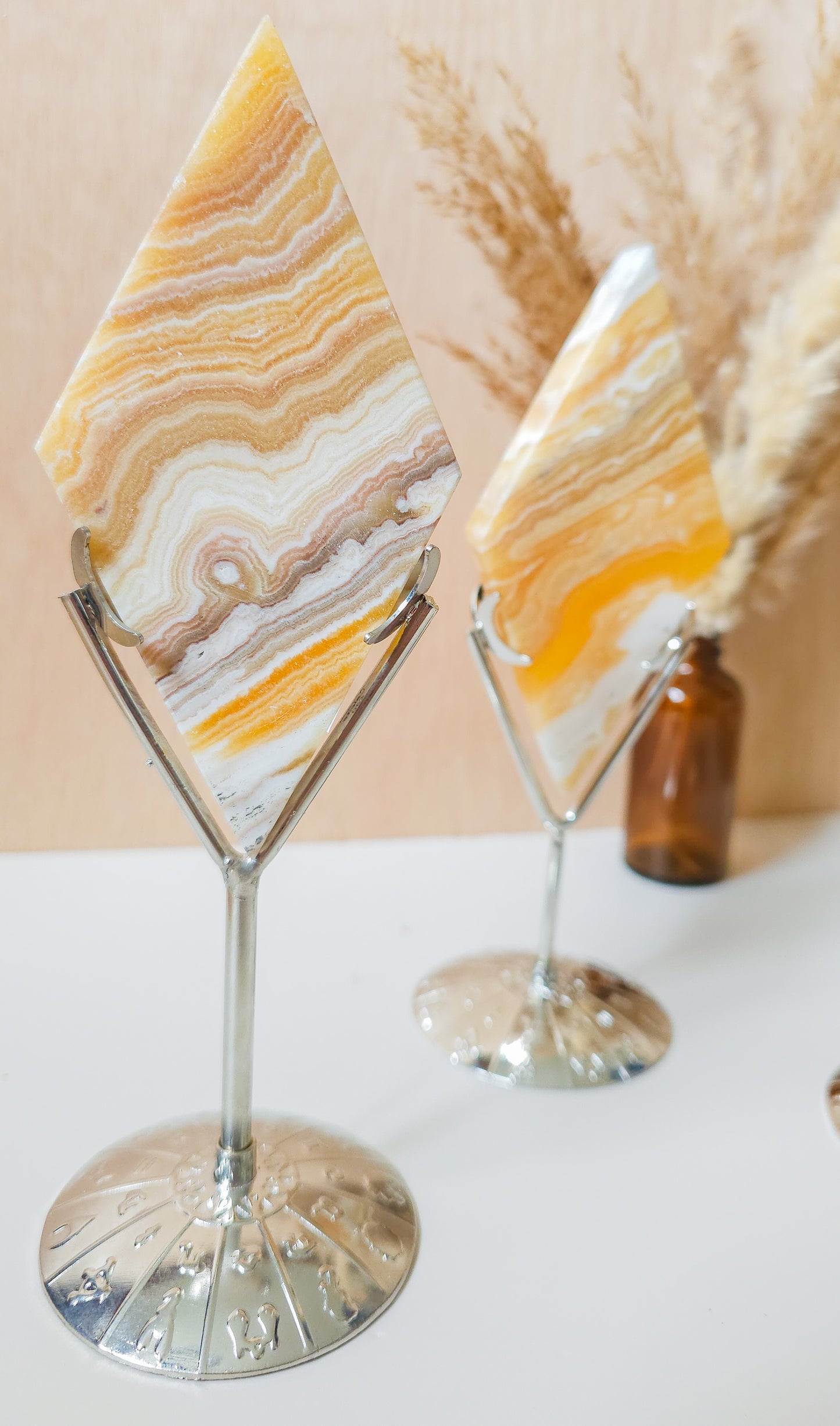 Orange Calcite Diamonds on the stand