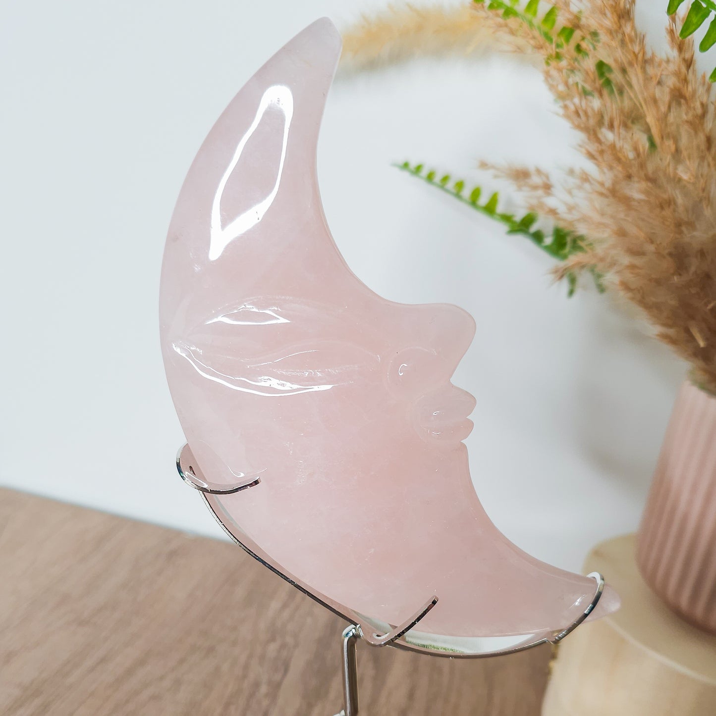 Rose Quartz Moon Face on the stand