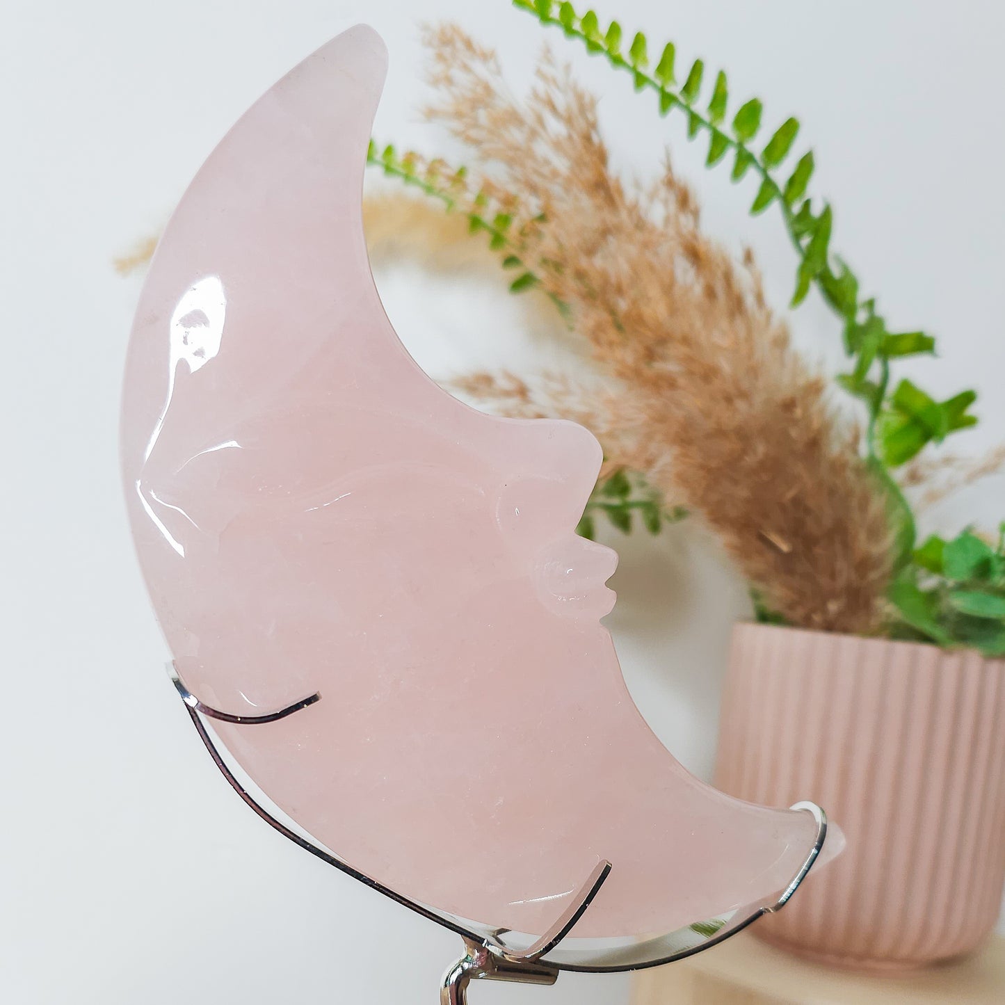 Rose Quartz Moon Face on the stand