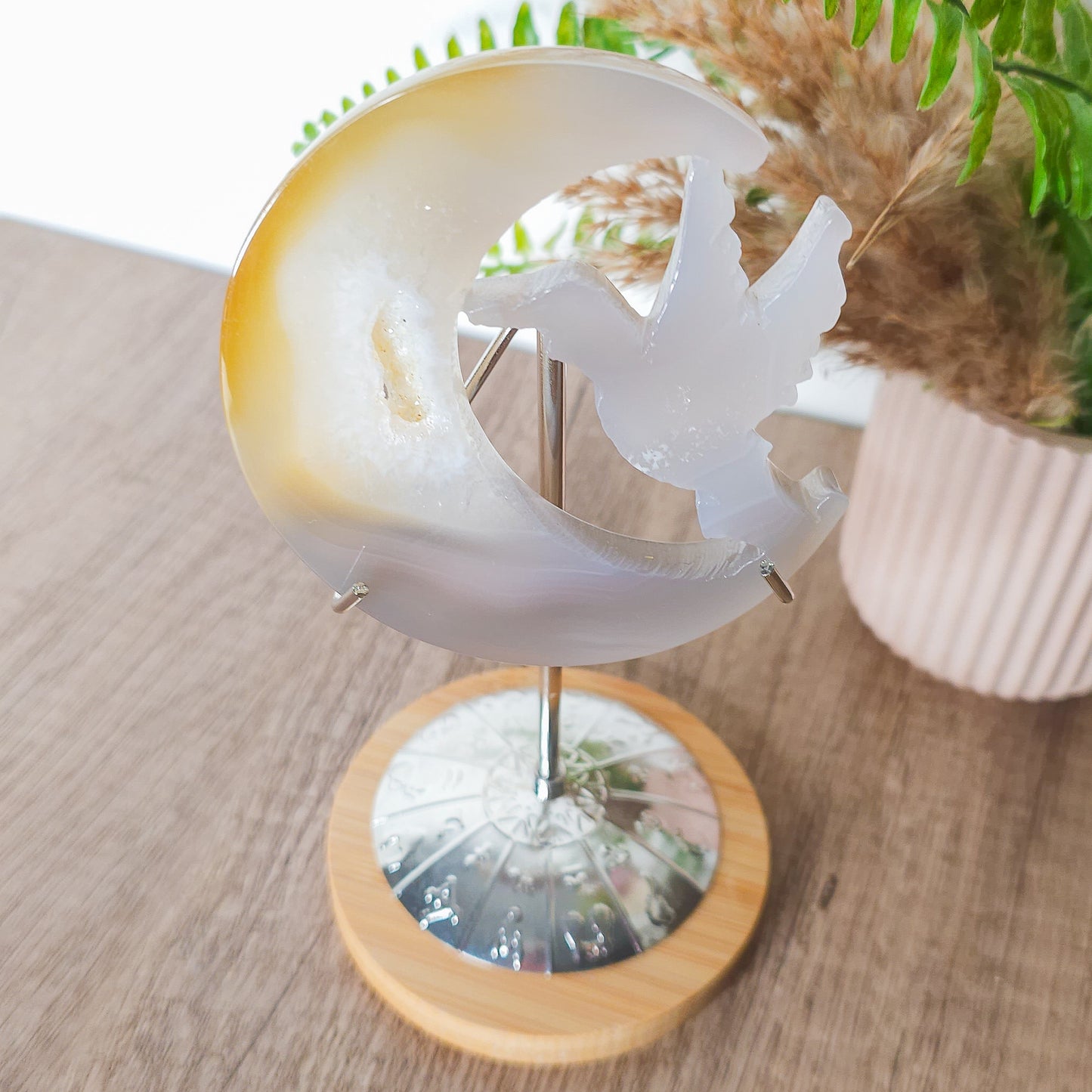 Druzy Agate Hummingbird With Moon Carving on the stand
