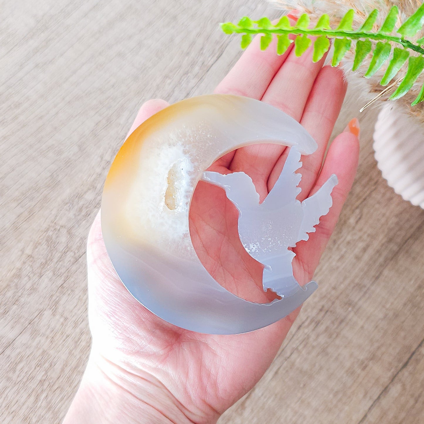 Druzy Agate Hummingbird With Moon Carving on the stand
