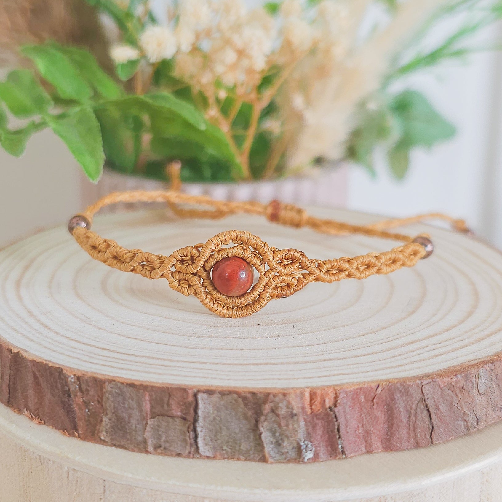 Handmade macrame bracelet with Red Jasper beads, infused with Strawberry Full Moon energy for strength, grounding, and emotional clarity