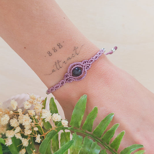 Handmade macrame bracelet with purple Fluorite beads, infused with Strawberry Full Moon energy for clarity, intuition, and emotional balance