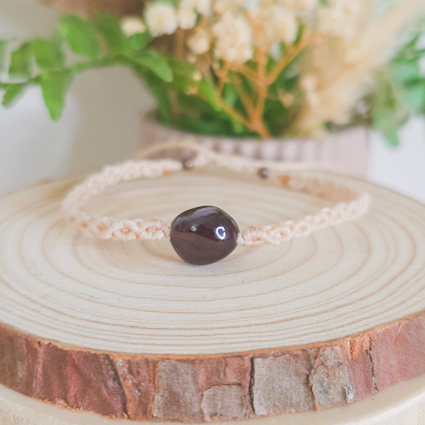 Handmade macrame bracelet with Garnet beads, infused with intention to support strength, grounding, and soul alignment