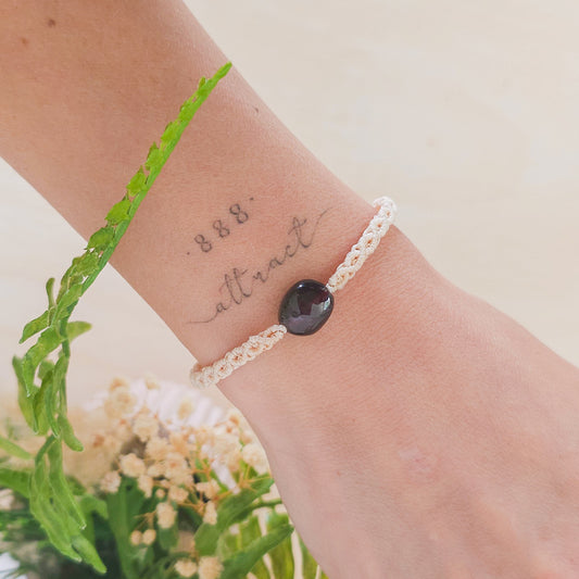 Handmade macrame bracelet with Garnet beads, infused with intention to support strength, grounding, and soul alignment