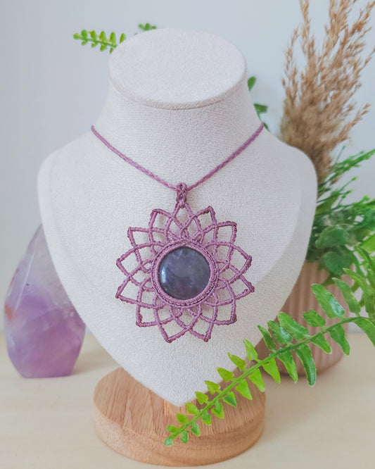Handwoven mandala necklace featuring a natural Amethyst crystal, symbolizing intuition, spiritual wisdom, and inner vision.