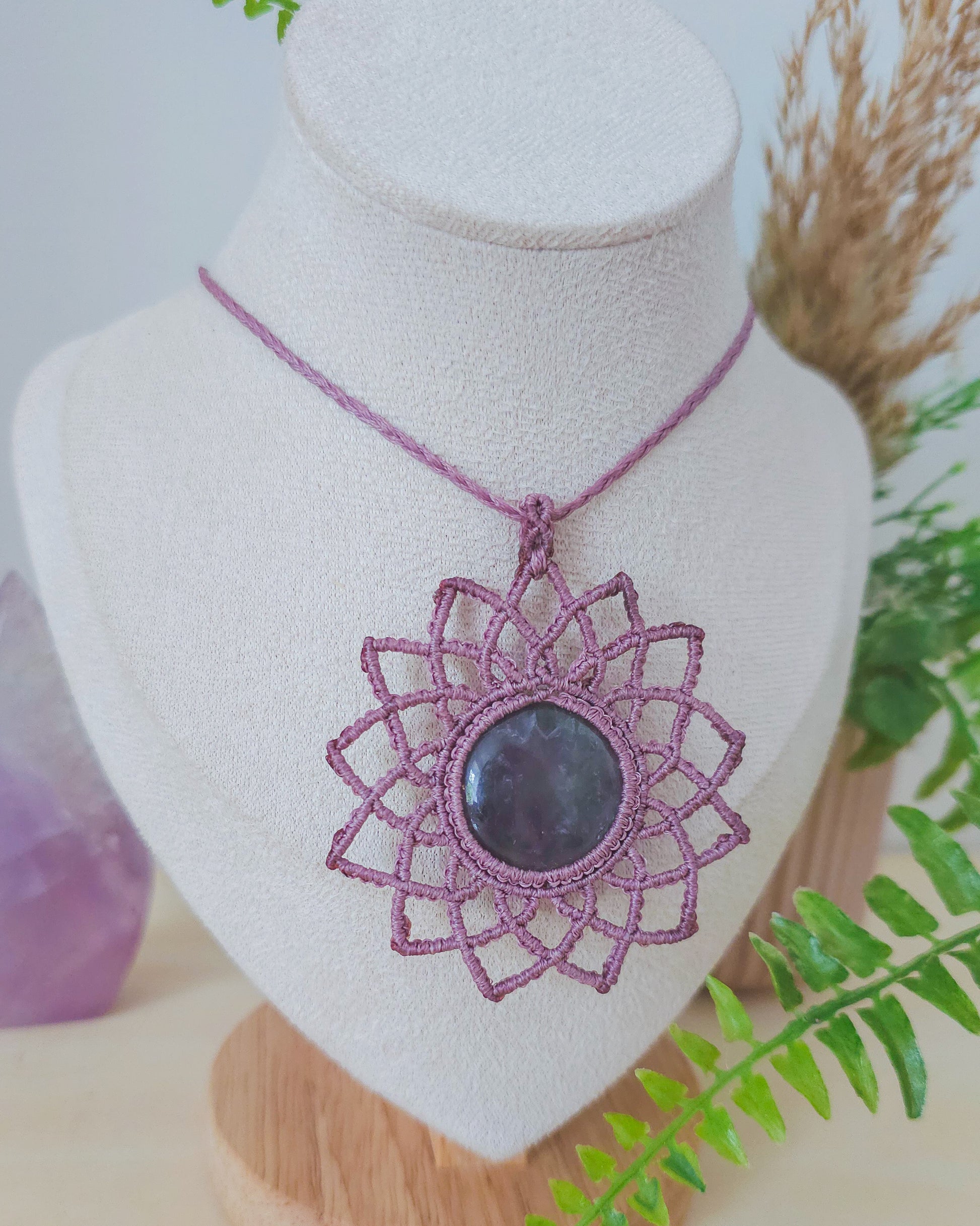 Artisan-made macrame necklace with Amethyst center stone, designed for clarity, protection, and higher consciousness.