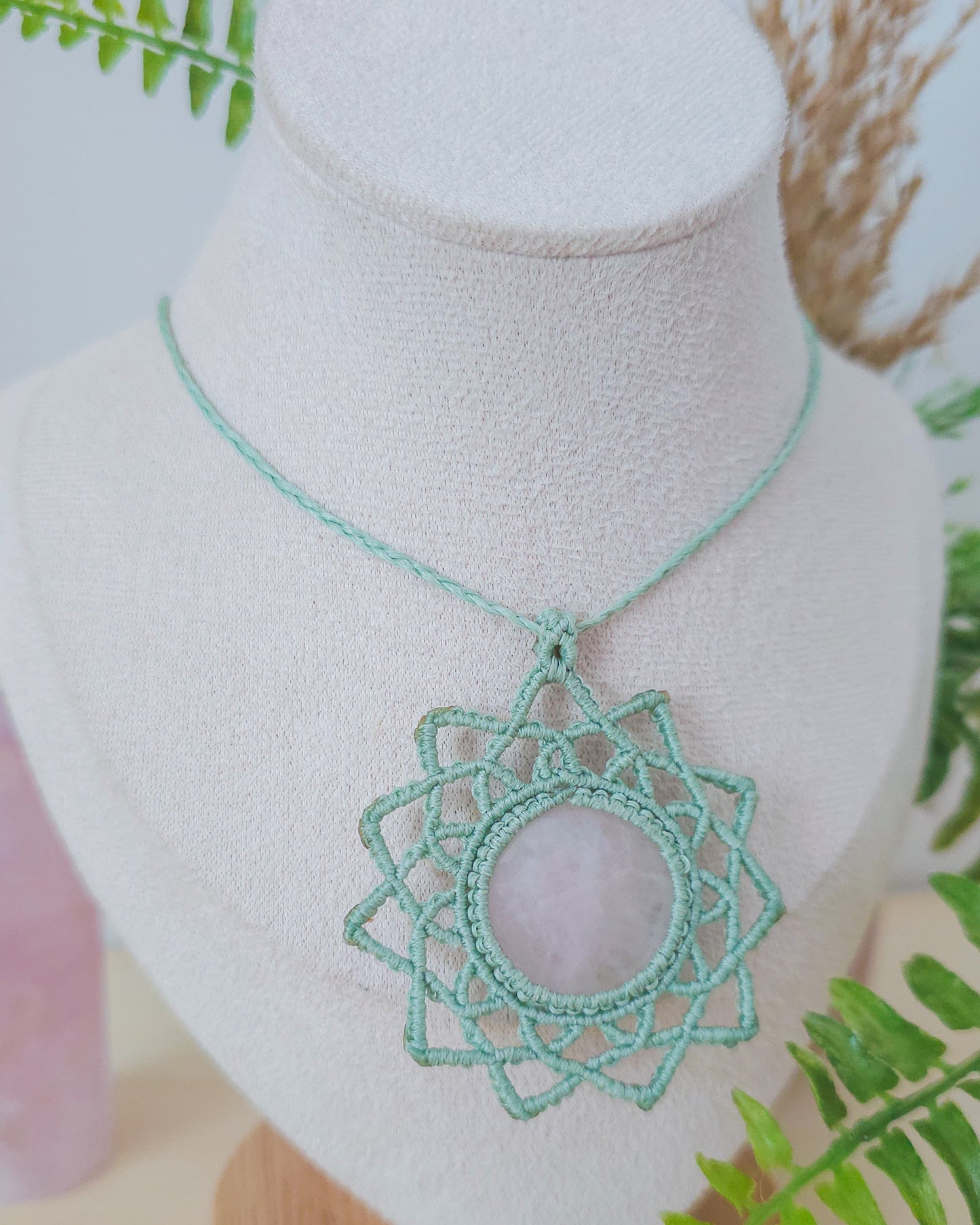 Handwoven mandala necklace with Rose Quartz crystal, inspired by Venus and designed for self-love and emotional healing.

