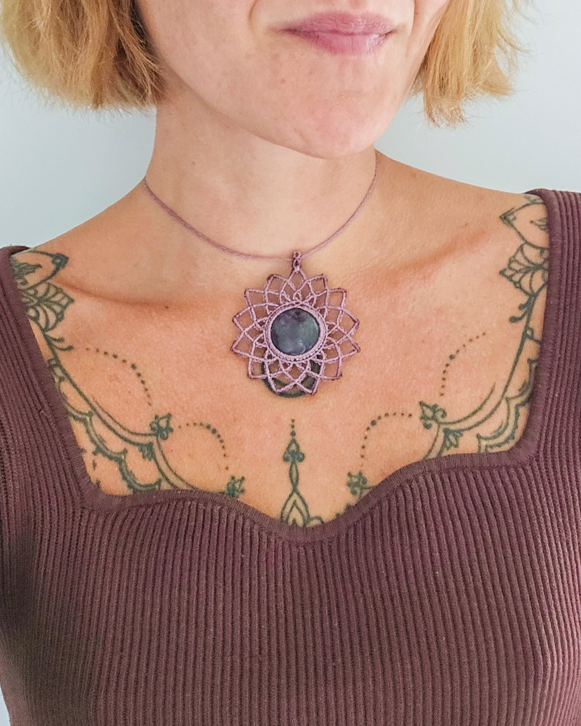 Close-up of Amethyst mandala necklace, a crystal jewelry piece inspired by the Seer and spiritual insight.