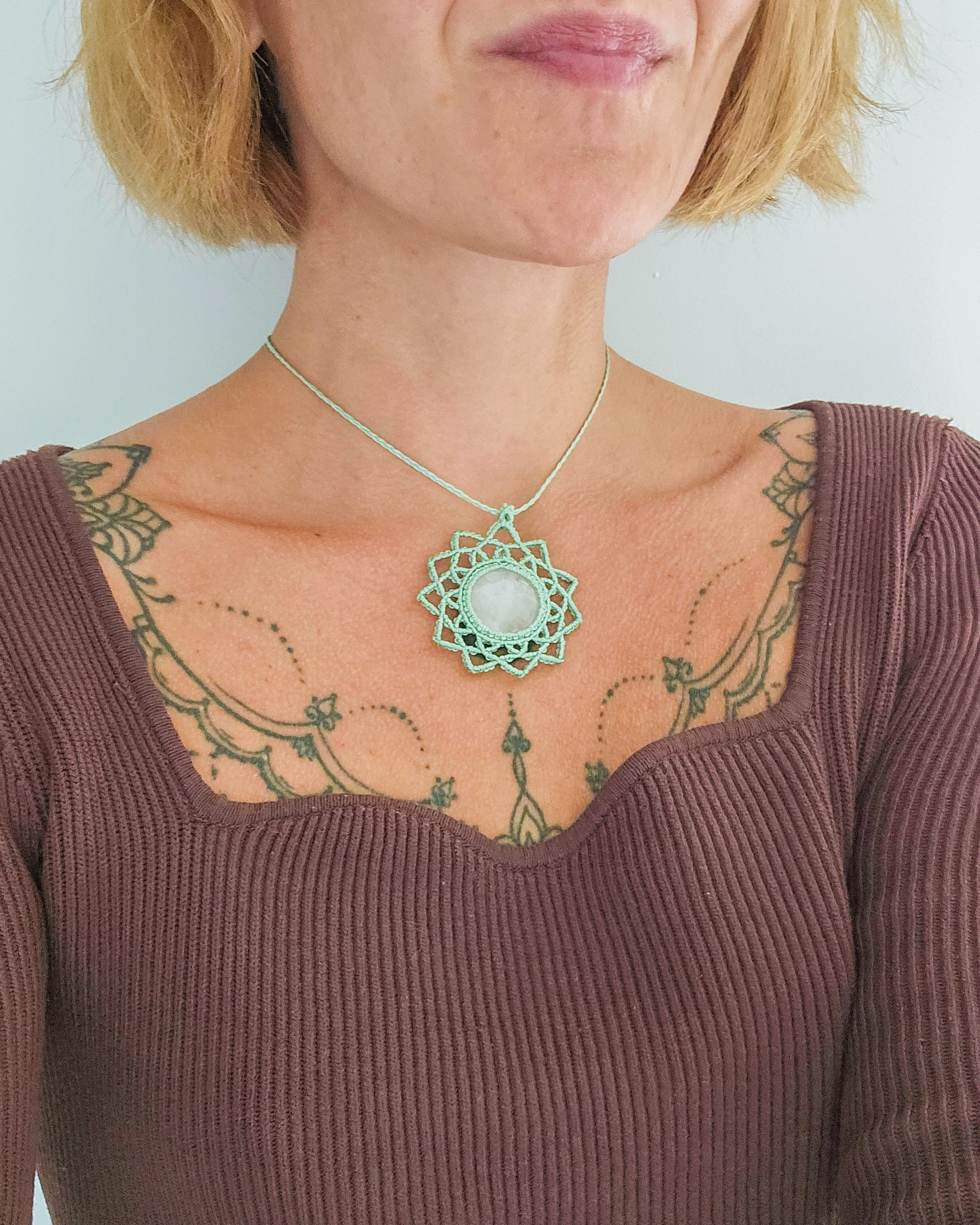 Artisan-made Rose Quartz necklace in mandala design, crystal jewelry for heart healing and spiritual connection.
