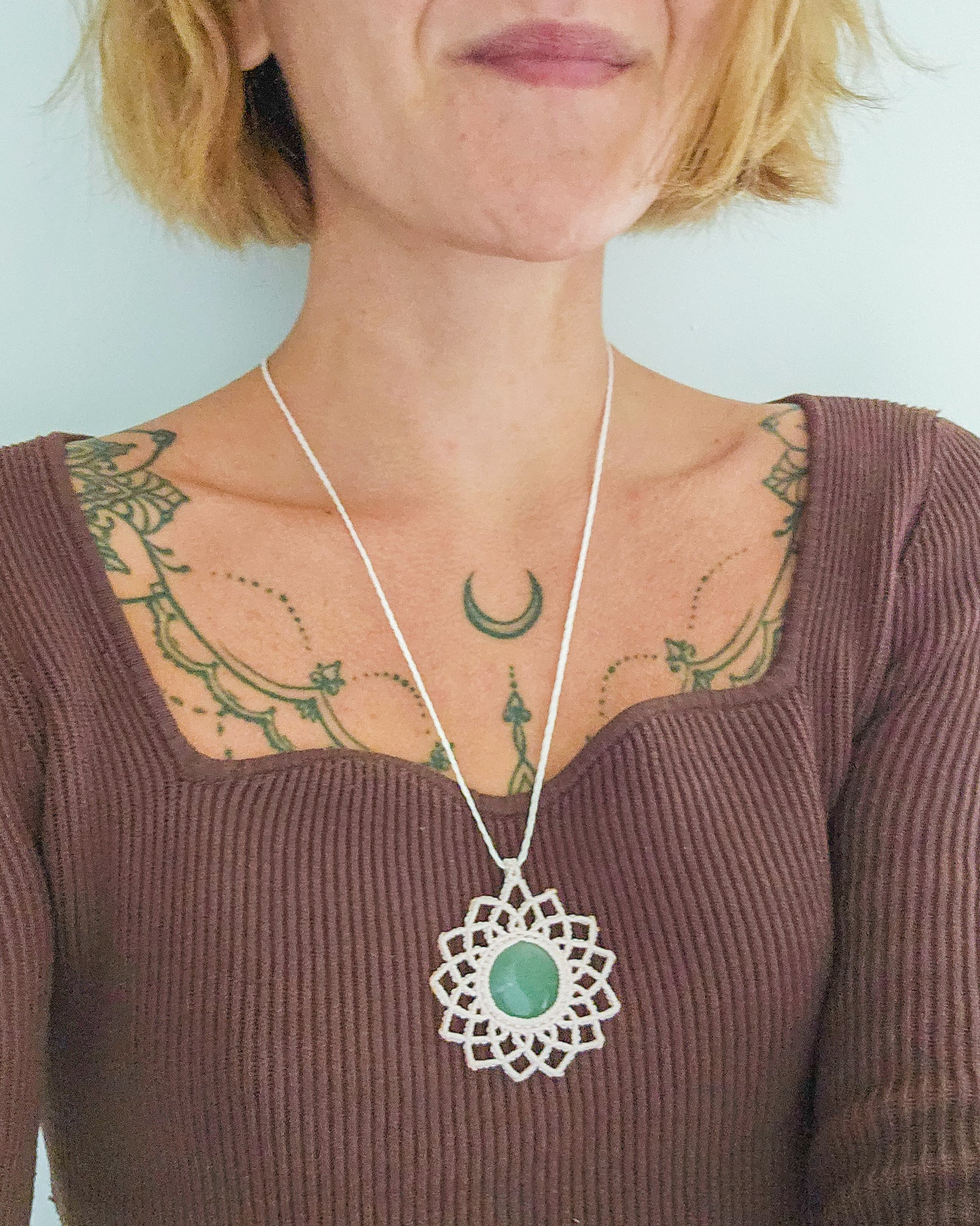 Handwoven mandala necklace with Green Aventurine crystal, inspired by Fortuna, goddess of luck and prosperity.
