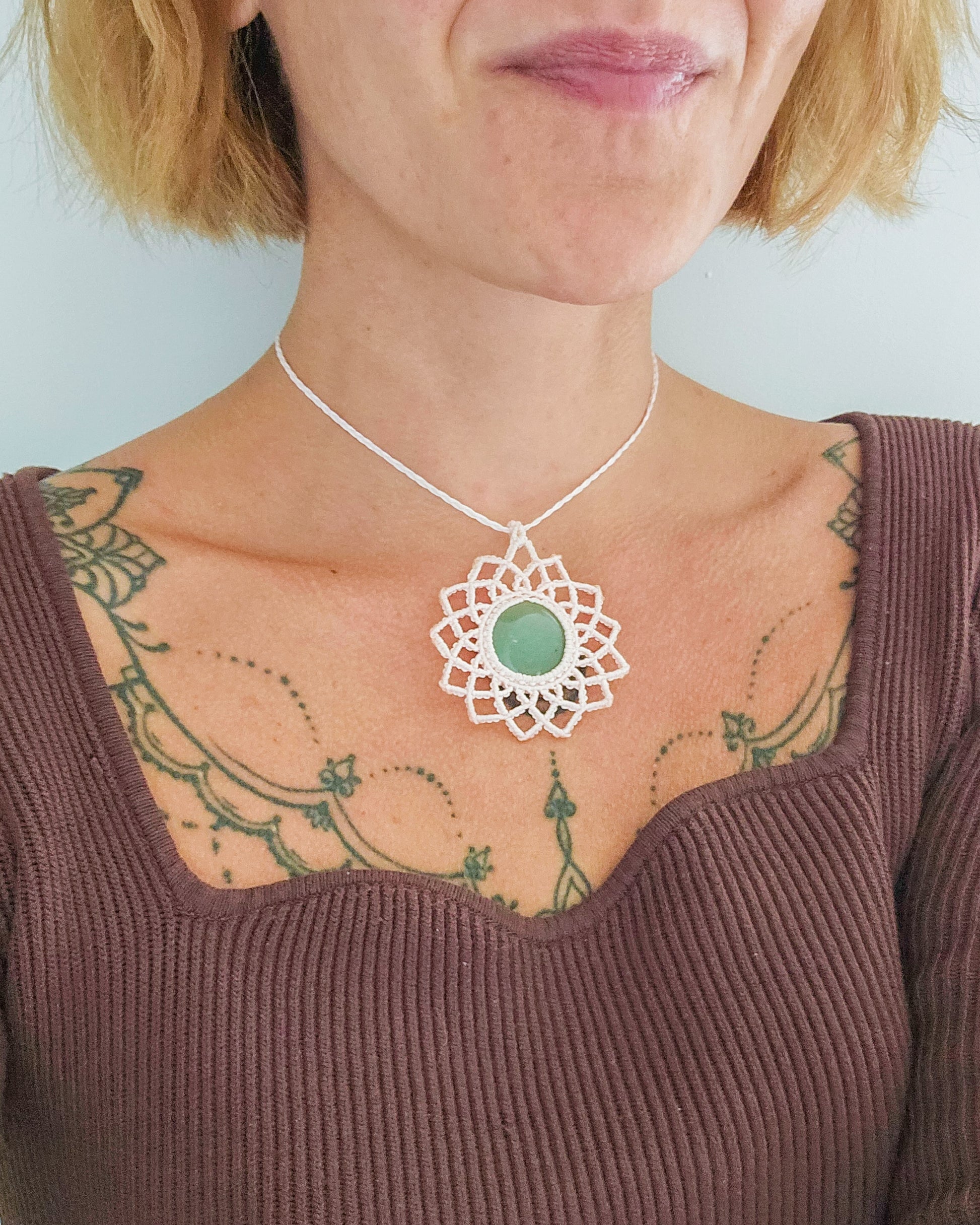 Artisan-made macrame necklace featuring natural Green Aventurine, designed to attract luck and emotional healing.