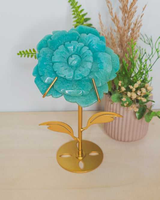 Amazonite flower crystal on metal stand, blue-green tones with petal details, symbolizing emotional balance and spiritual growth.
