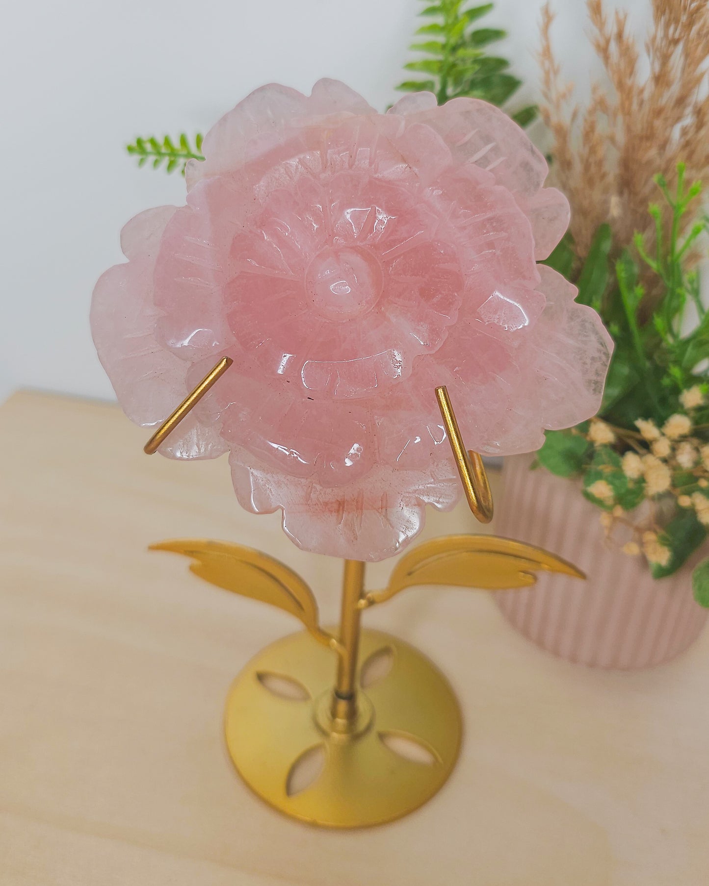 Close-up of Rose Quartz flower carving showing detailed petals and natural soft pink color, representing love, self-worth, and compassion.
