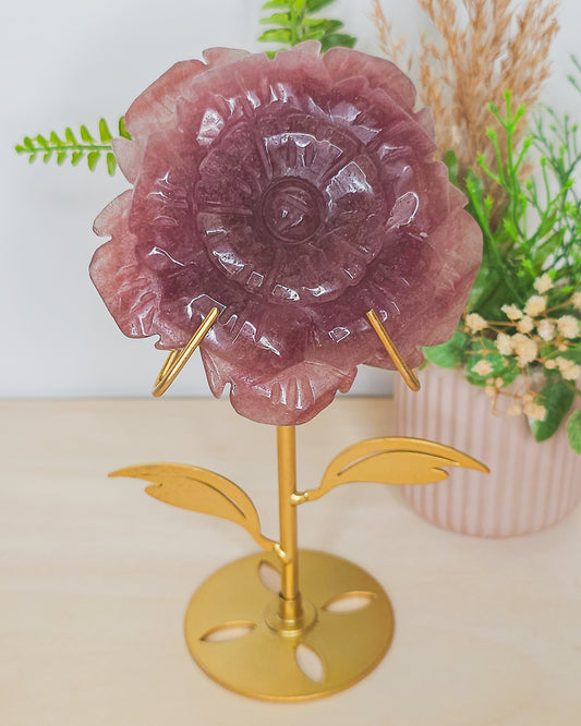 Strawberry Quartz flower crystal on metal stand, soft pink tones with sparkles symbolizing joy, love, and emotional healing.