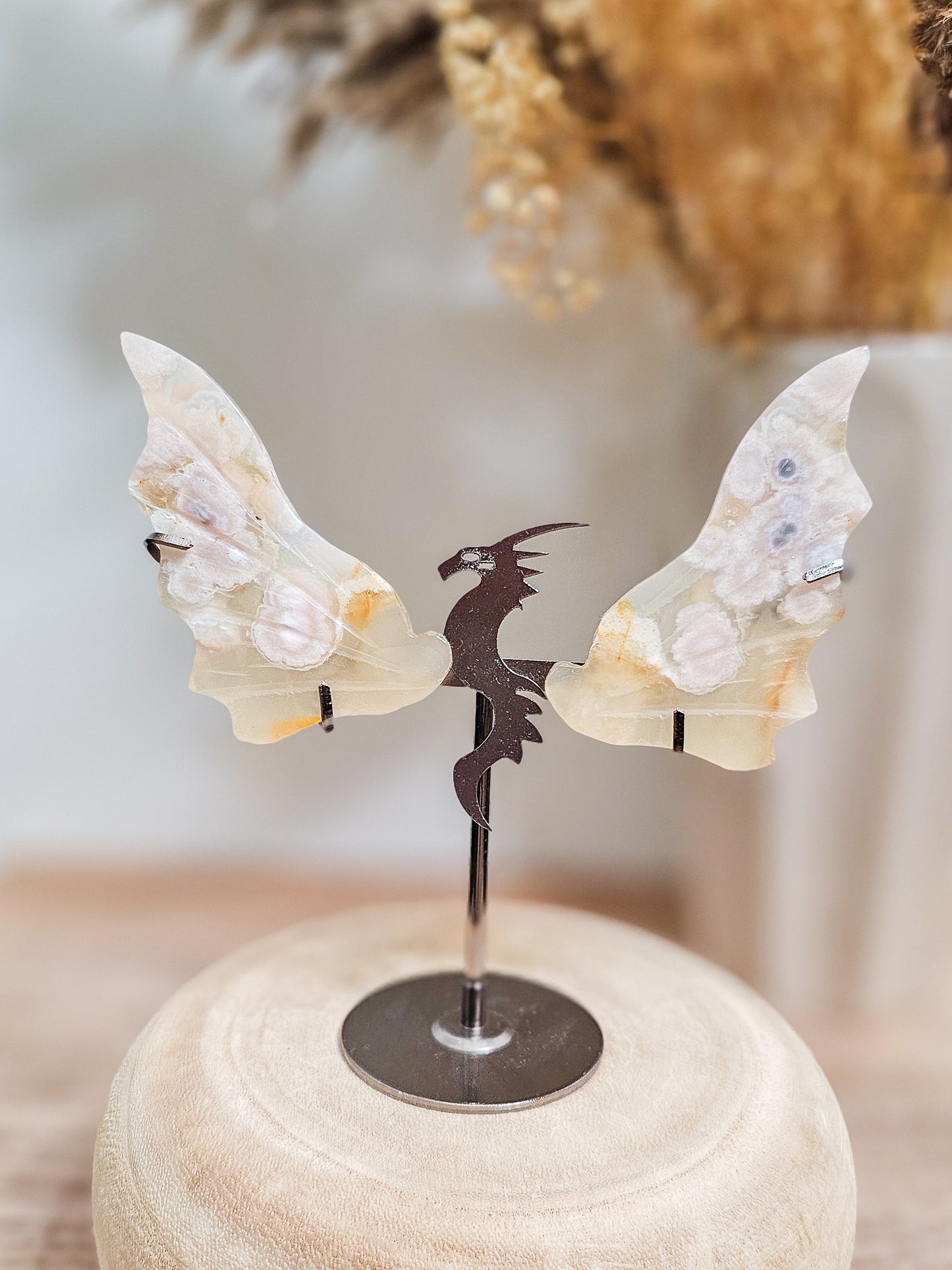 Pair of Flower Agate dragon wings on display stand, ideal for altar, meditation, or decorative use