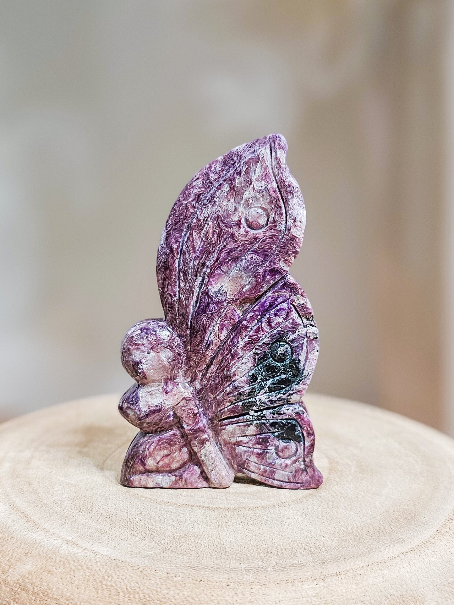 Delicate Charoite fairy sculpture, ideal for spiritual display, meditation, or crystal collection