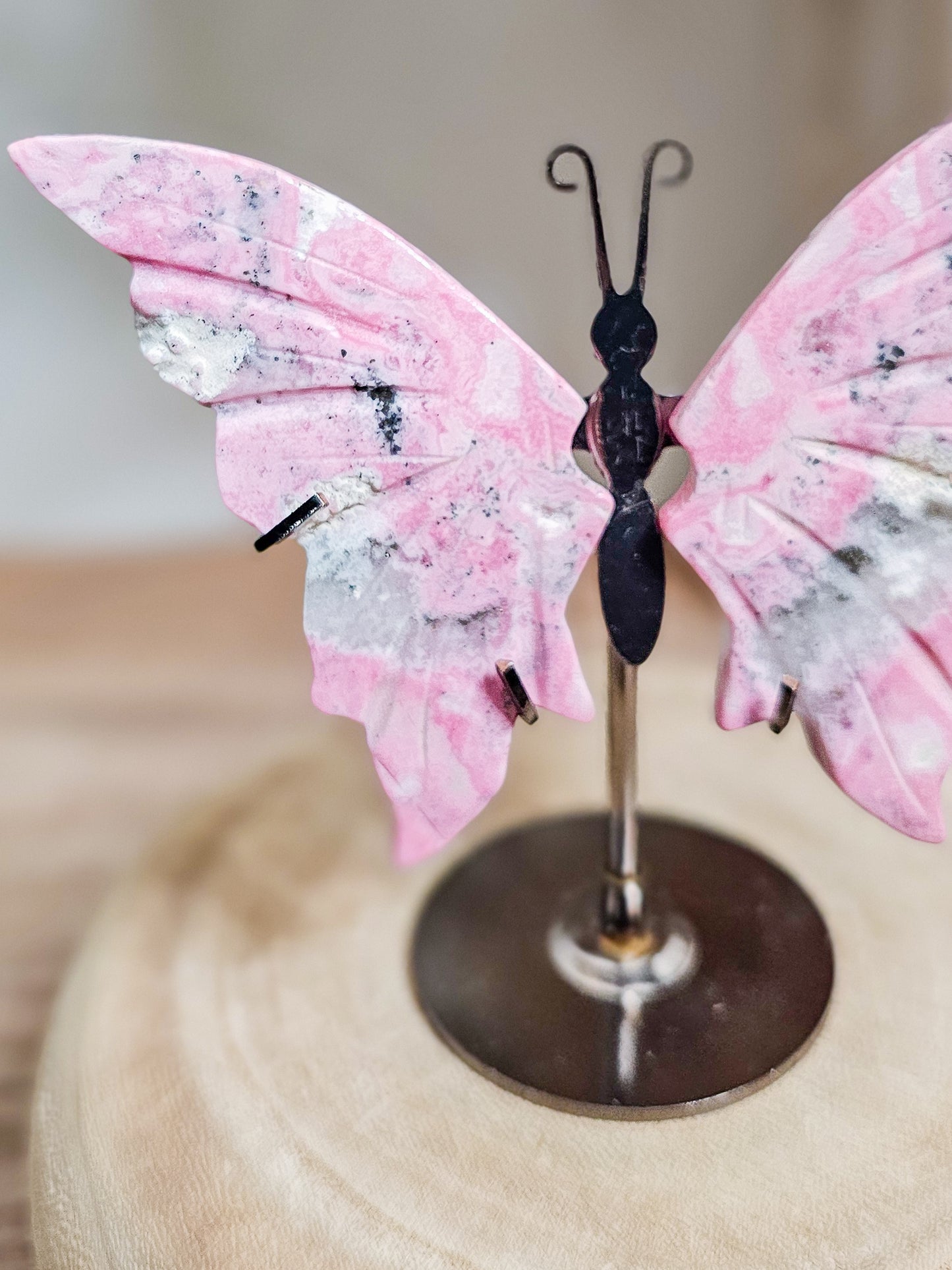 Butterfly wings crystal carving in Peruvian Rhodonite, ideal for altar, meditation, or calming decor