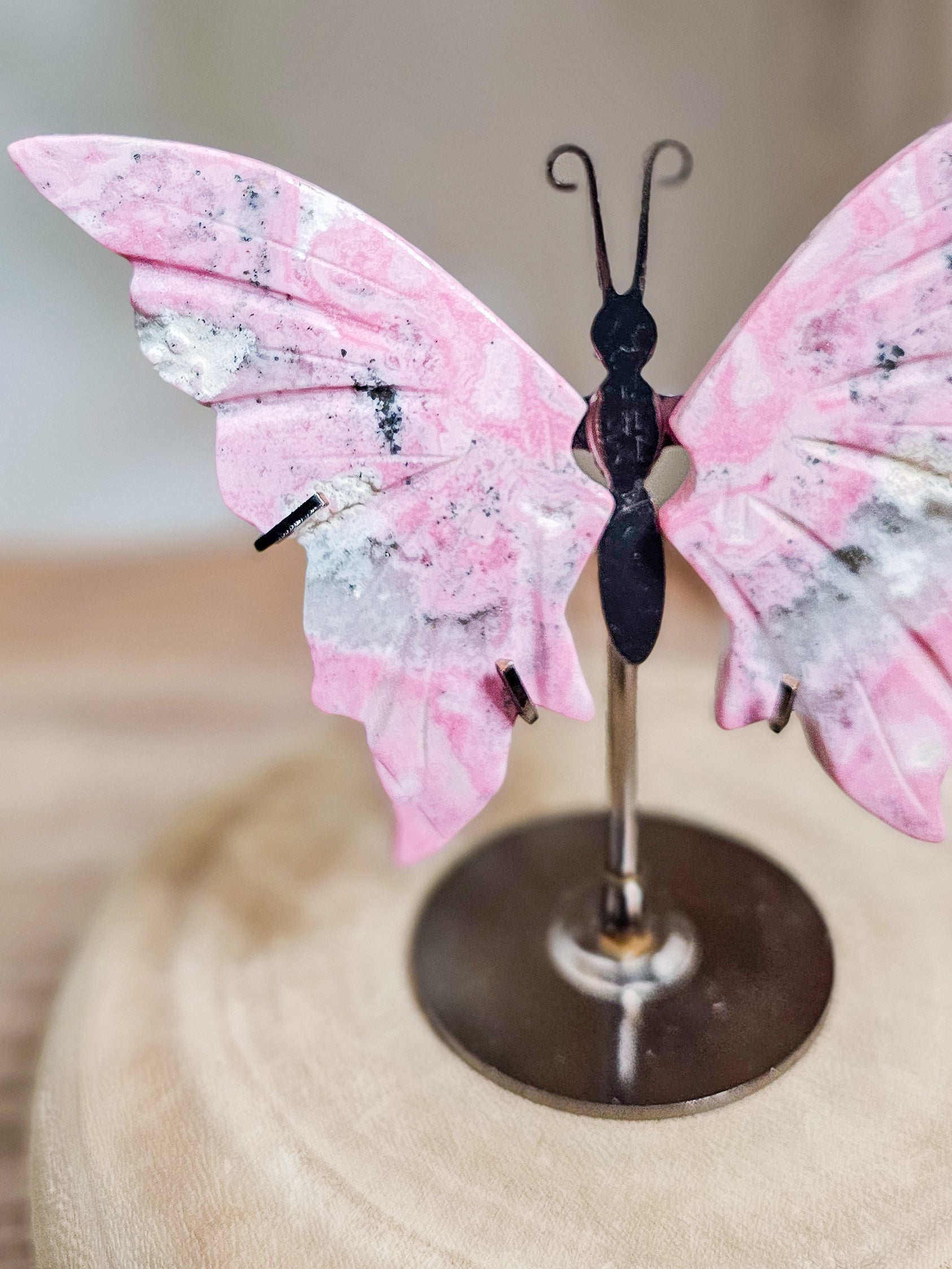 Butterfly wings crystal carving in Peruvian Rhodonite, ideal for altar, meditation, or calming decor