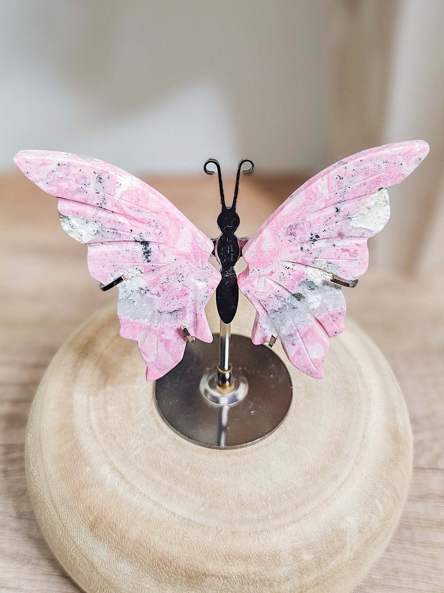 Peruvian Rhodonite butterfly wings sculpture, symbolising compassion and emotional healing