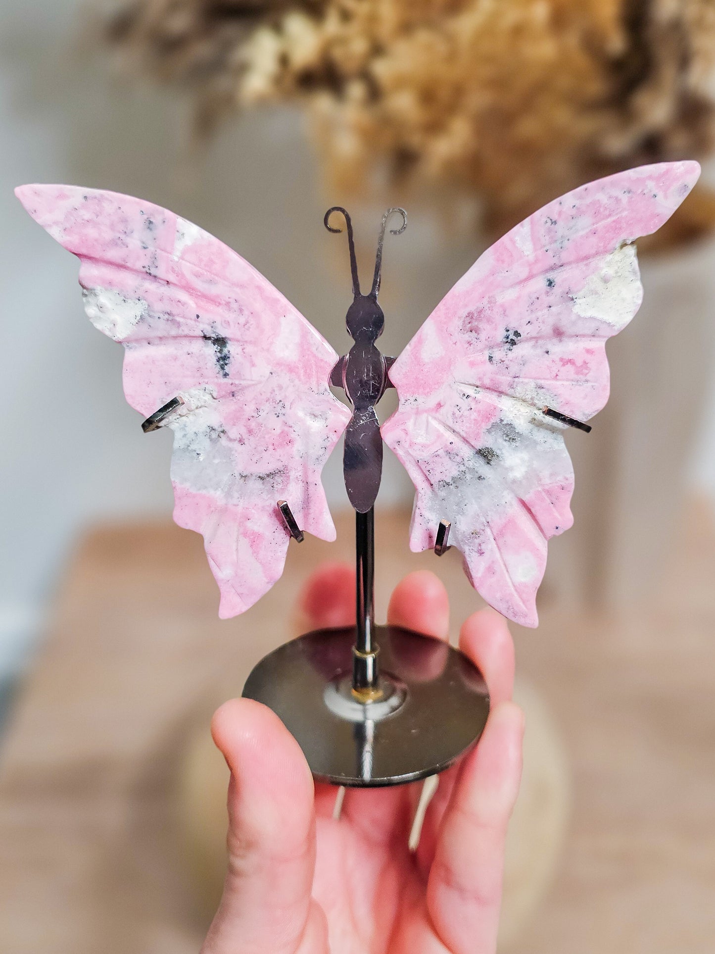 Butterfly wings crystal carving in Peruvian Rhodonite, ideal for altar, meditation, or calming decor