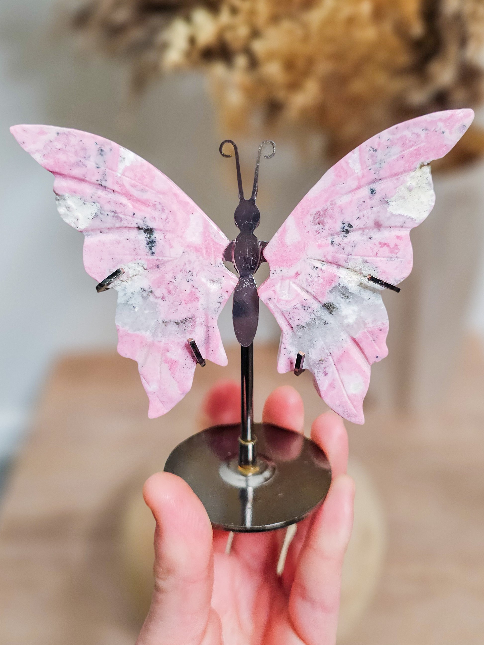 Butterfly wings crystal carving in Peruvian Rhodonite, ideal for altar, meditation, or calming decor