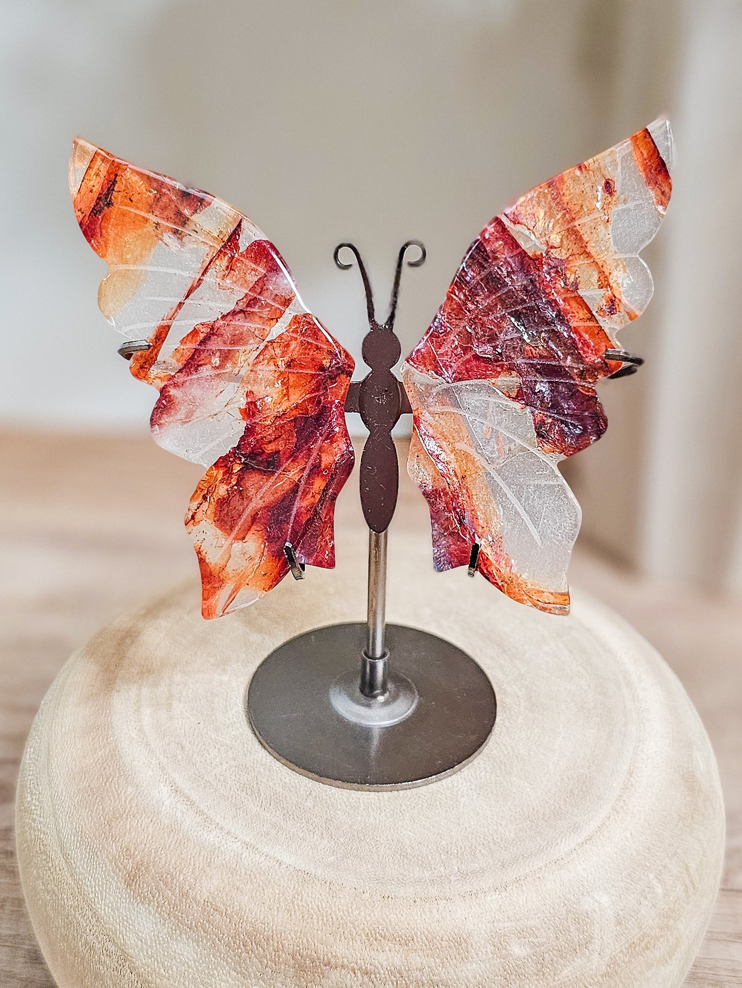 Fire quartz butterfly wings sculpture, symbolising grounded transformation and vitality