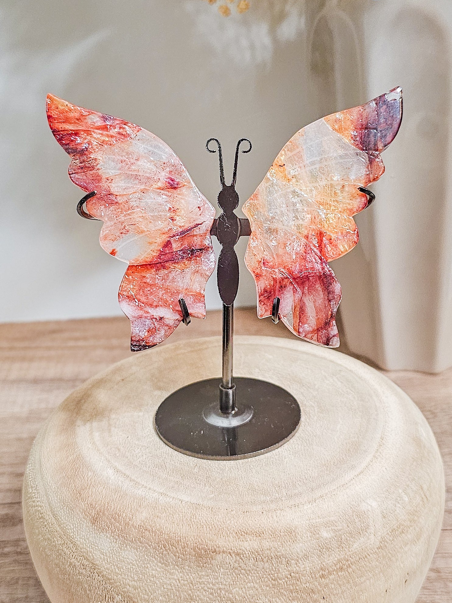 Fire quartz butterfly wings sculpture, symbolising grounded transformation and vitality