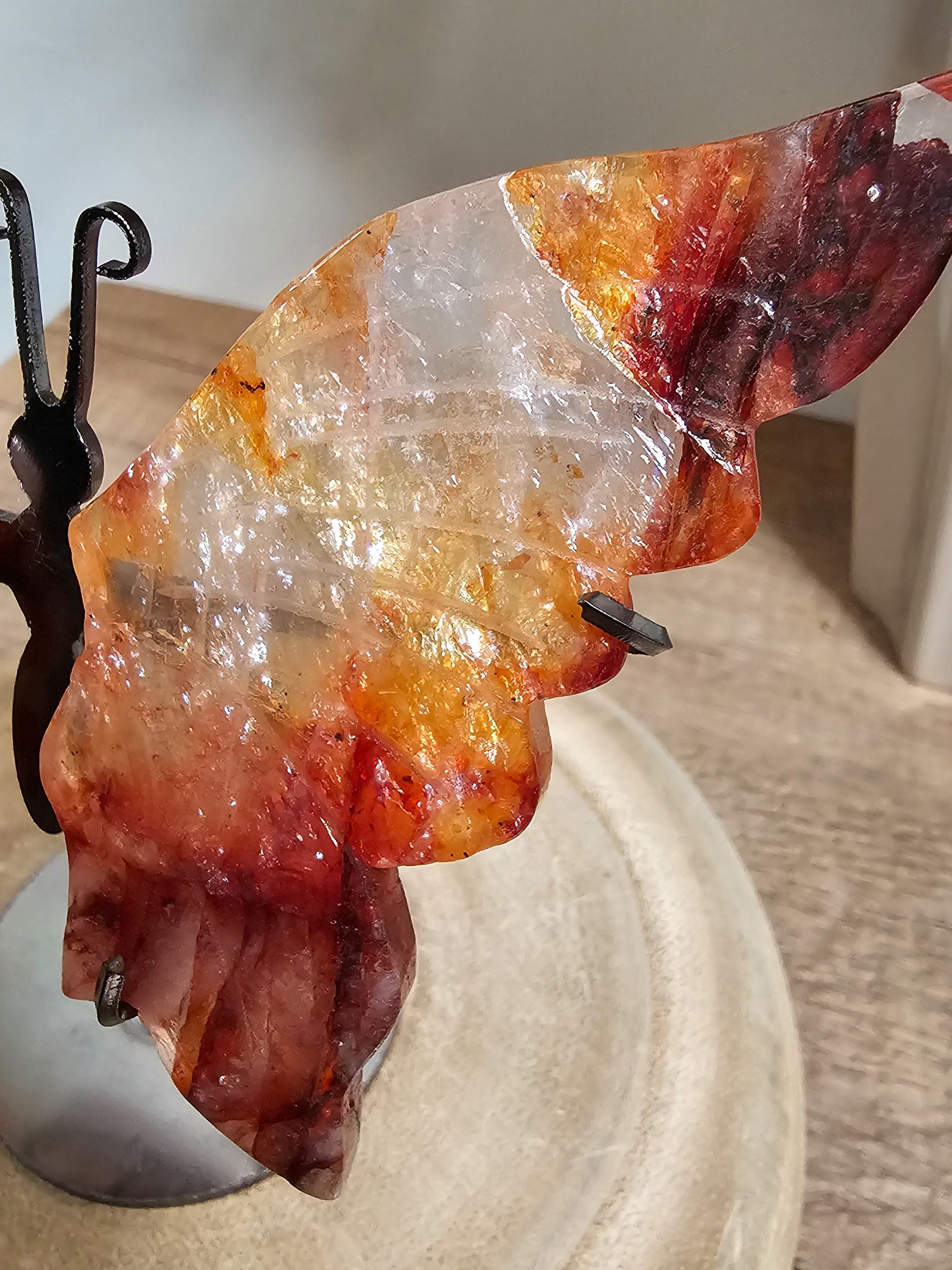Butterfly wings crystal carving in red hematoid quartz, ideal for altar, meditation, or grounding decor
