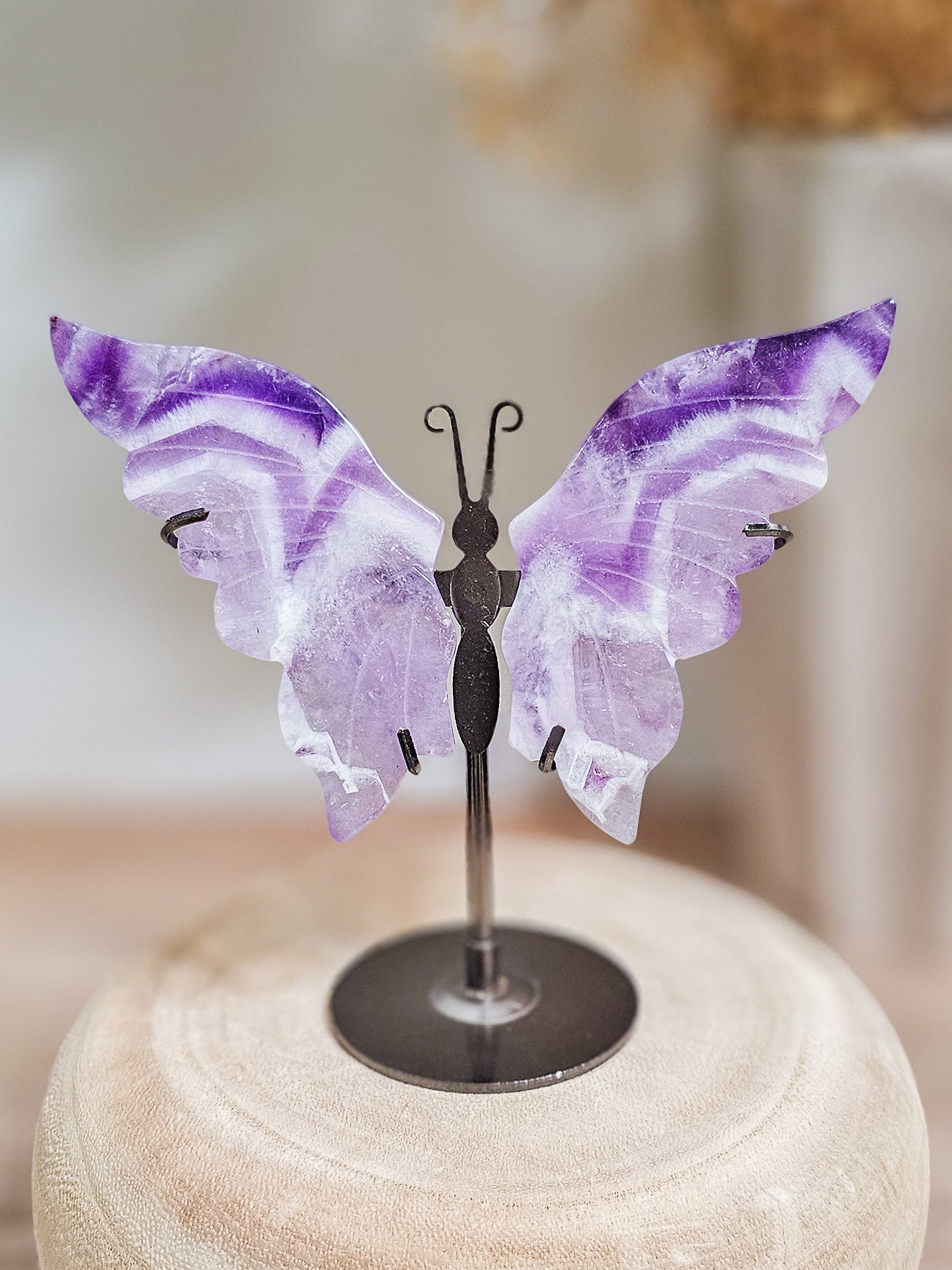 Amethyst butterfly wings on stand, carved purple quartz crystal with smooth polished wings and natural crystal clarity