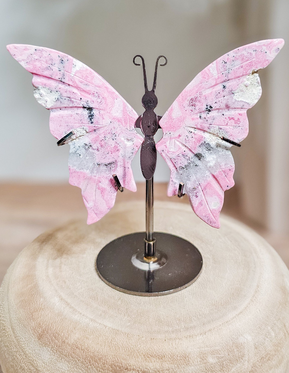 Peruvian Rhodonite butterfly wings on stand, carved pink rhodonite with natural dark veining and delicate wing shape