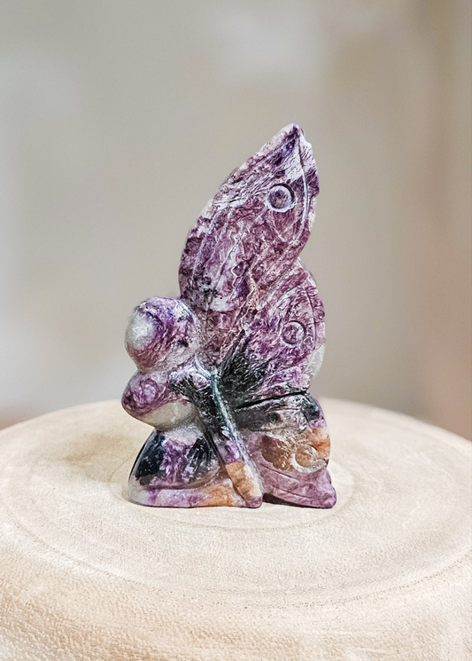 Delicate Charoite fairy sculpture, ideal for spiritual display, meditation, or crystal collection
